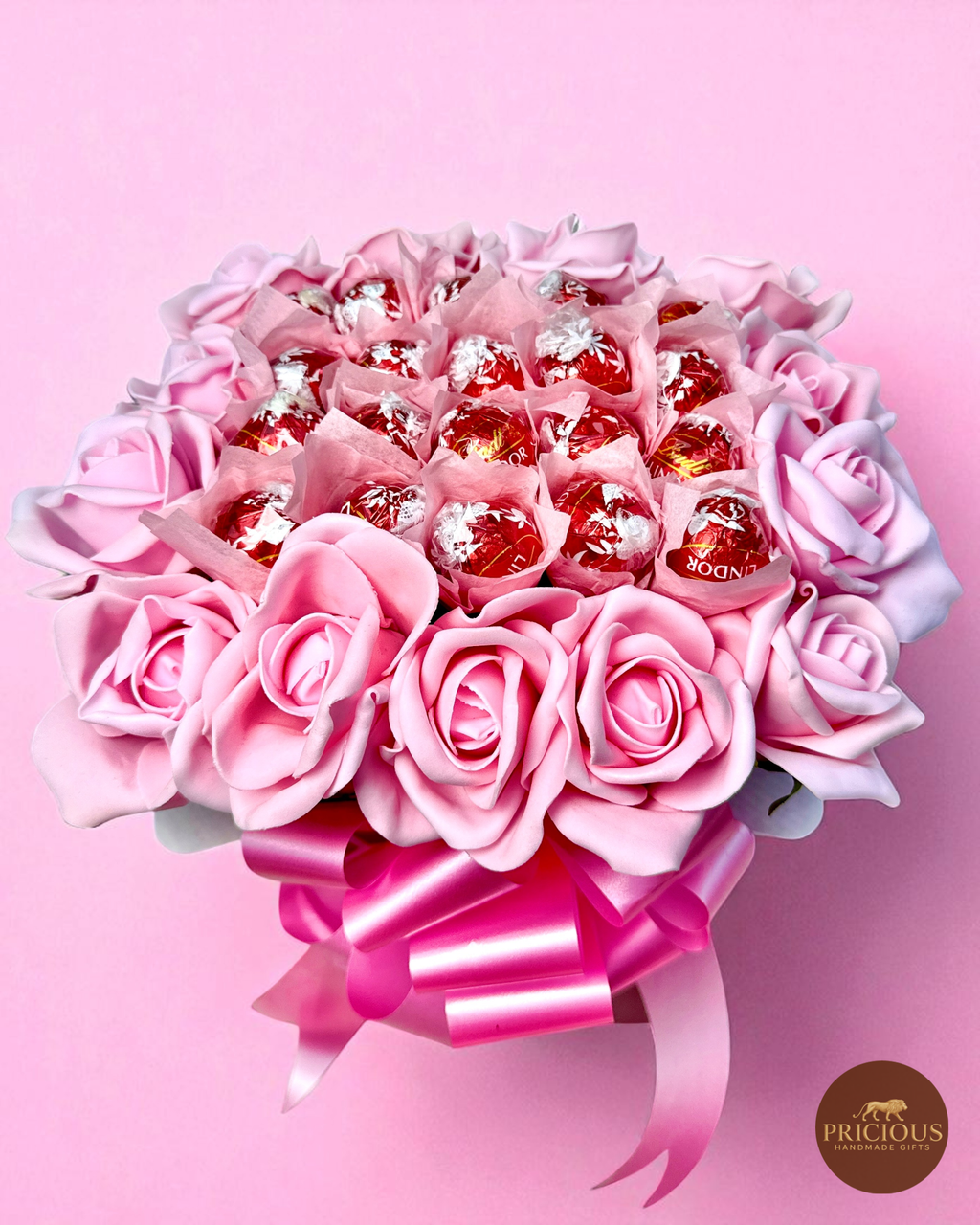 Top view Lindt Lindor truffle bouquet with pink roses