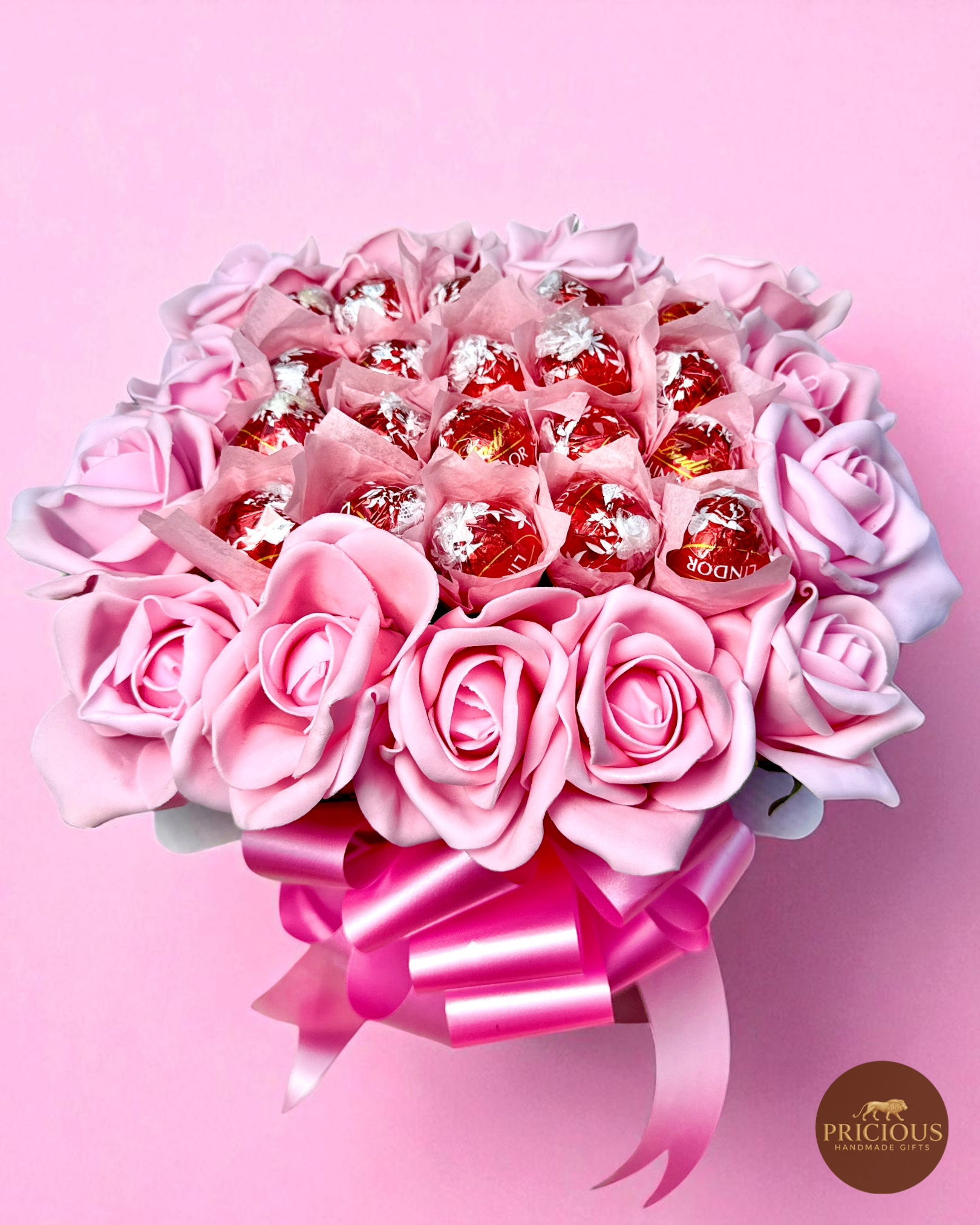 Top view Lindt Lindor truffle bouquet with pink roses