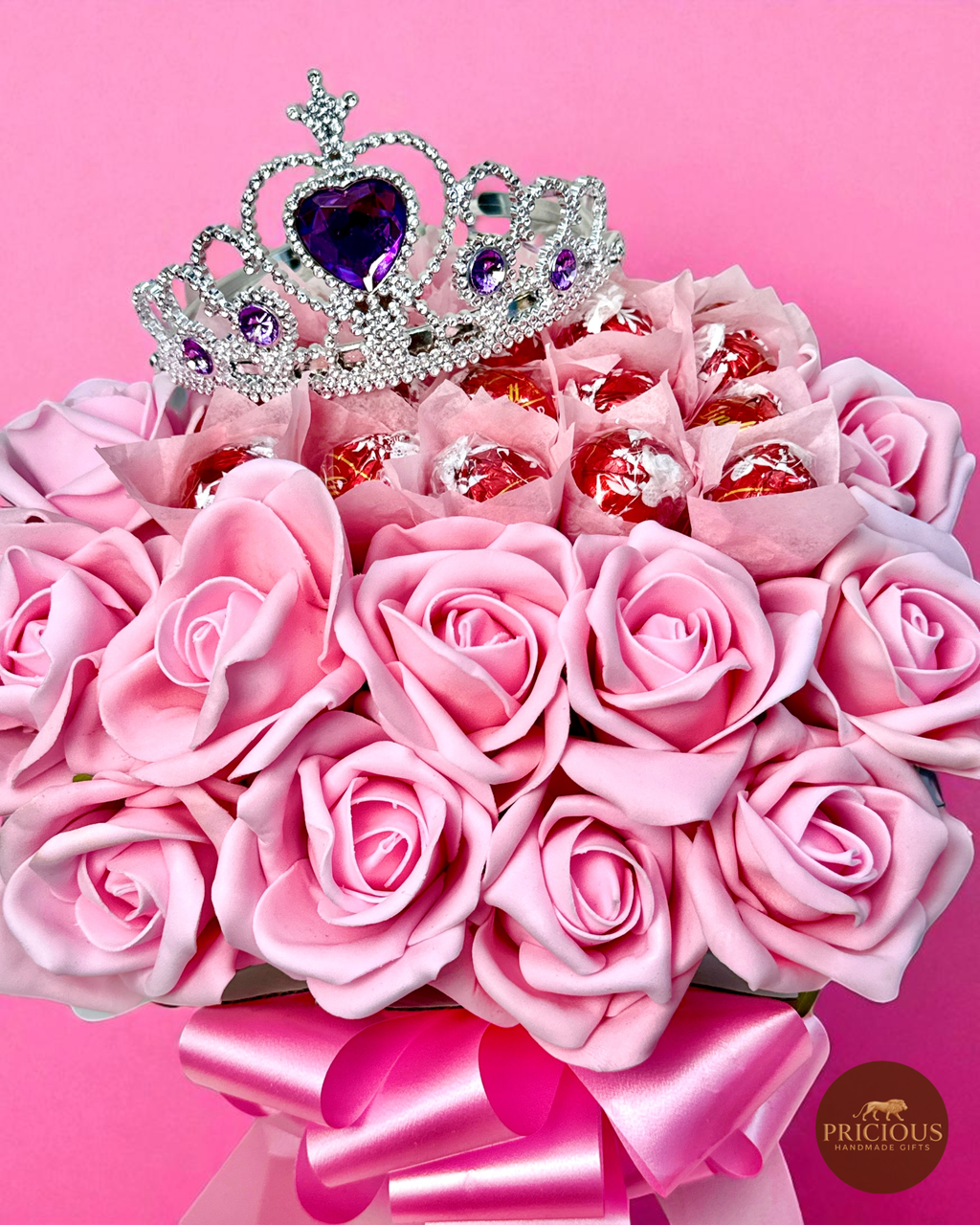 Close-up of tiara on pink rose Lindor bouquet