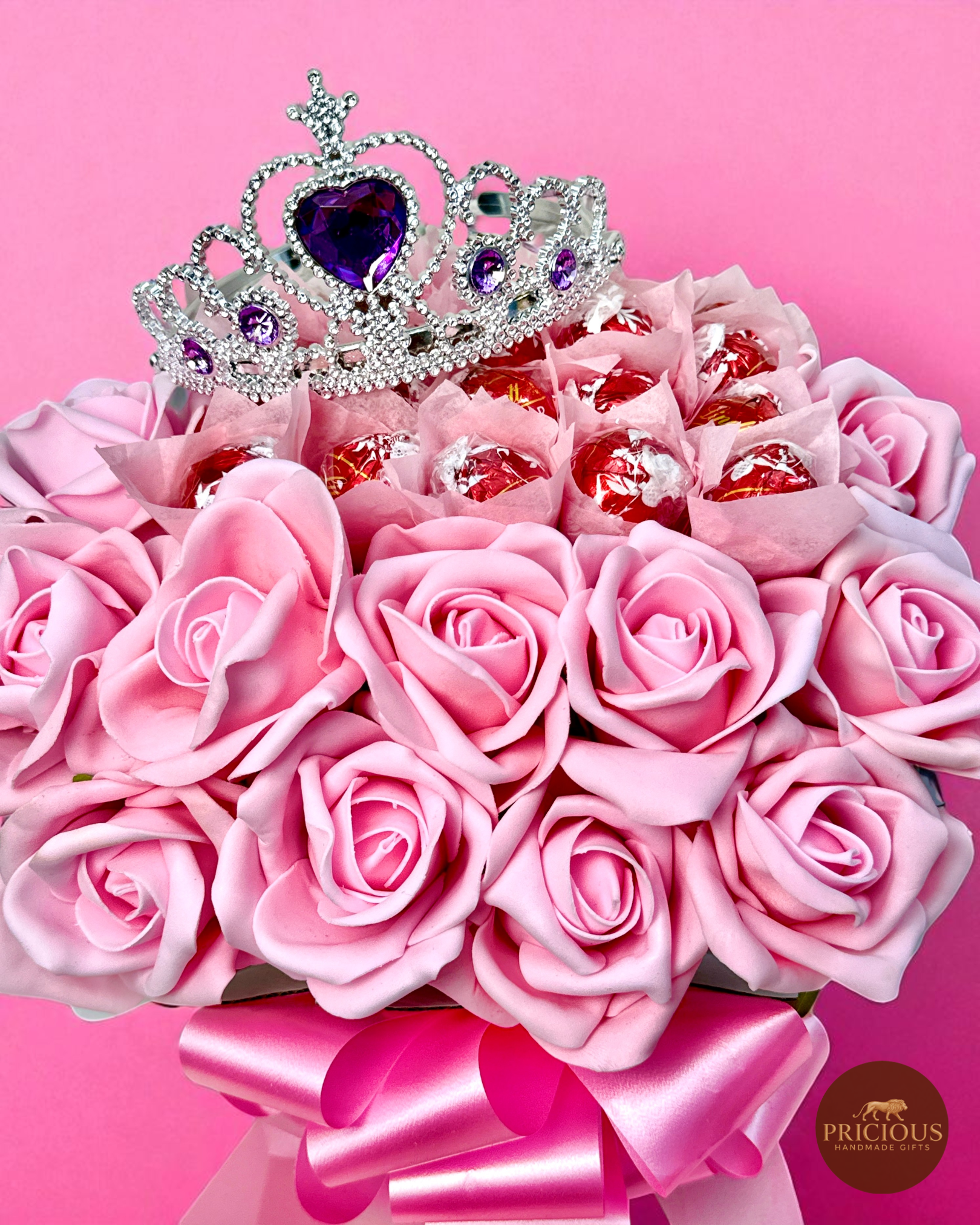 Close-up of tiara on pink rose Lindor bouquet