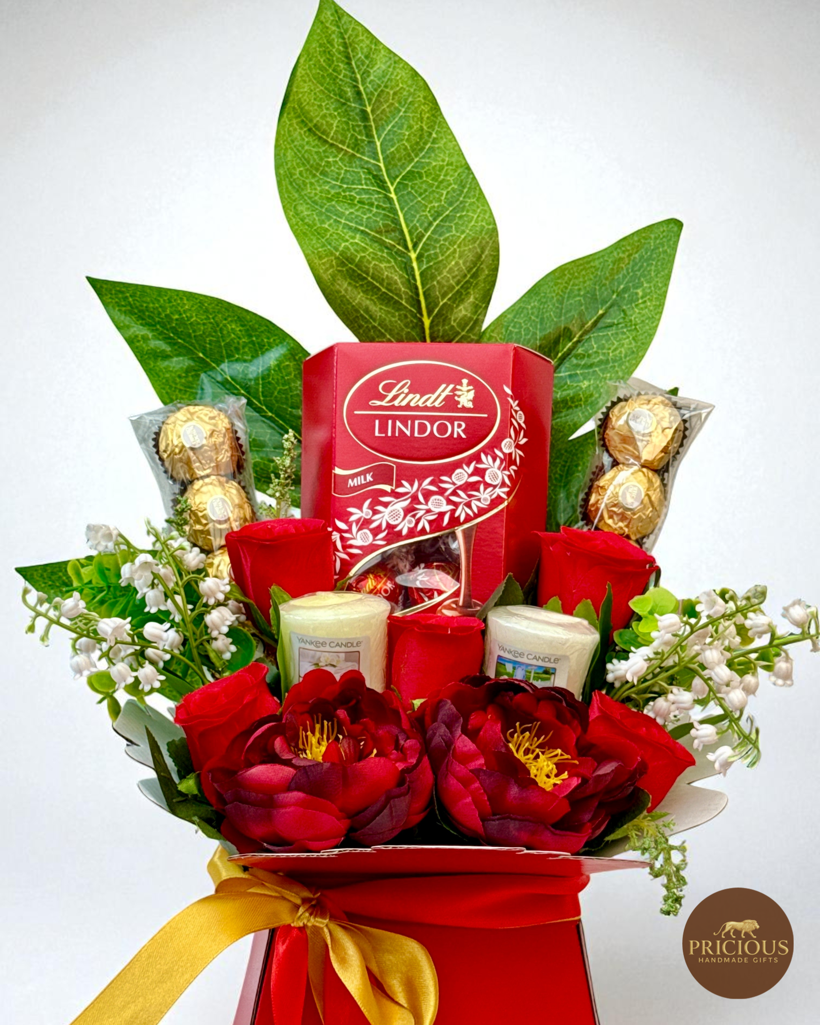Close-up Lindt & Ferrero bouquet with Yankee votives (front view)
