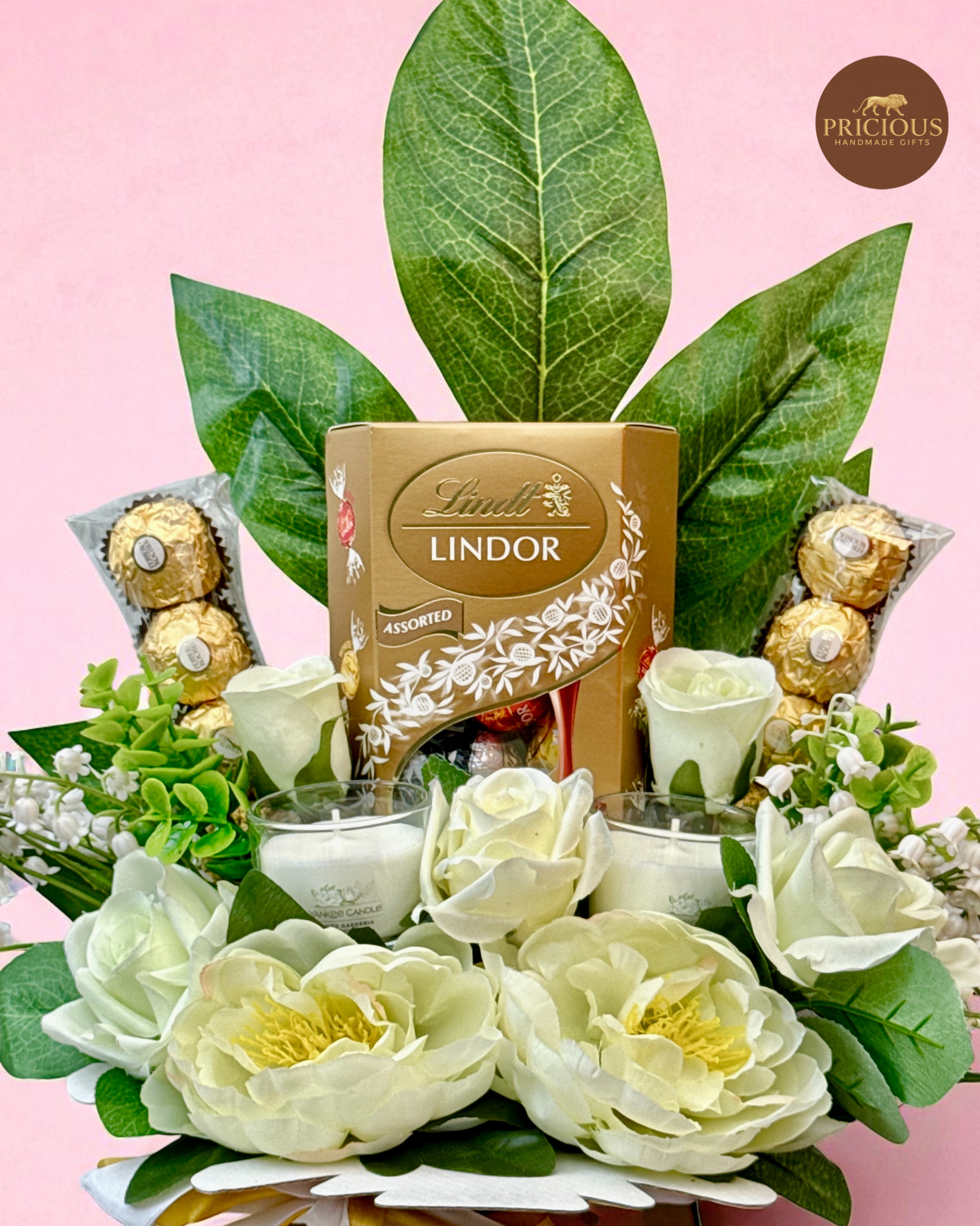 Close view White & Gold bouquet with Lindt, Ferrero Rocher and candles