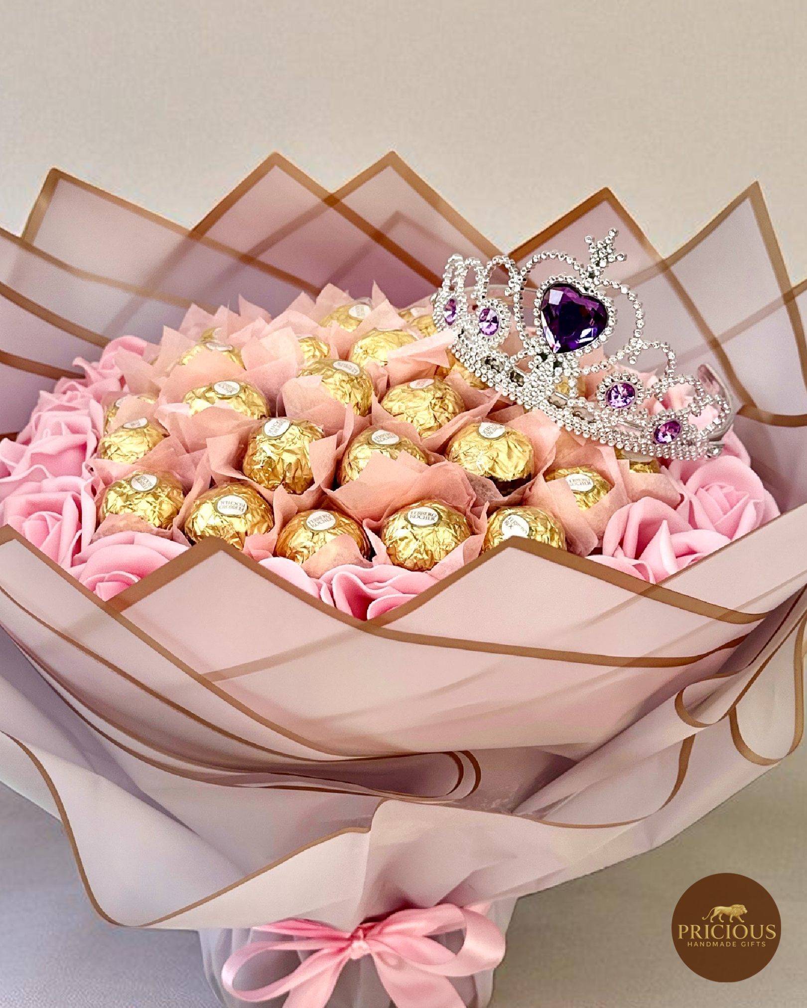 Close-up of Ferrero Rocher bouquet with purple wrap and crystal tiara