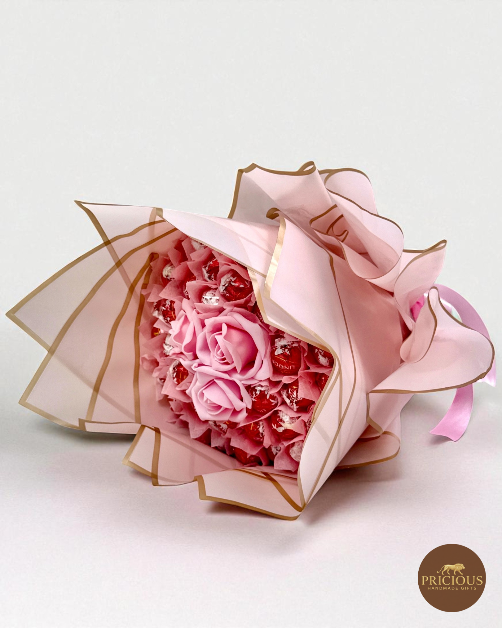 Lindor pink roses chocolate gift bouquet in blush gold-edged wrap