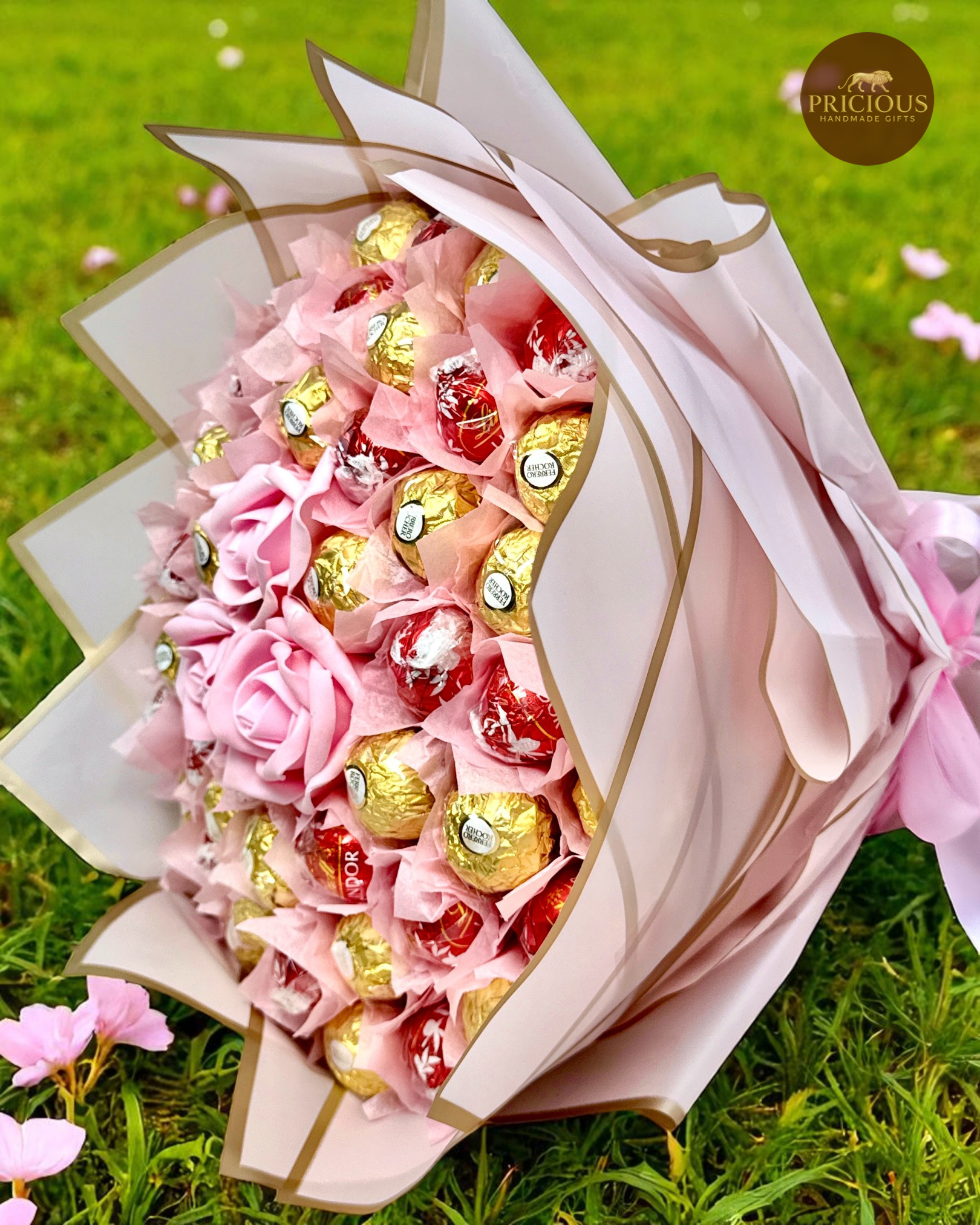 Side view chocolate bouquet with blush roses and gold-edged wrap
