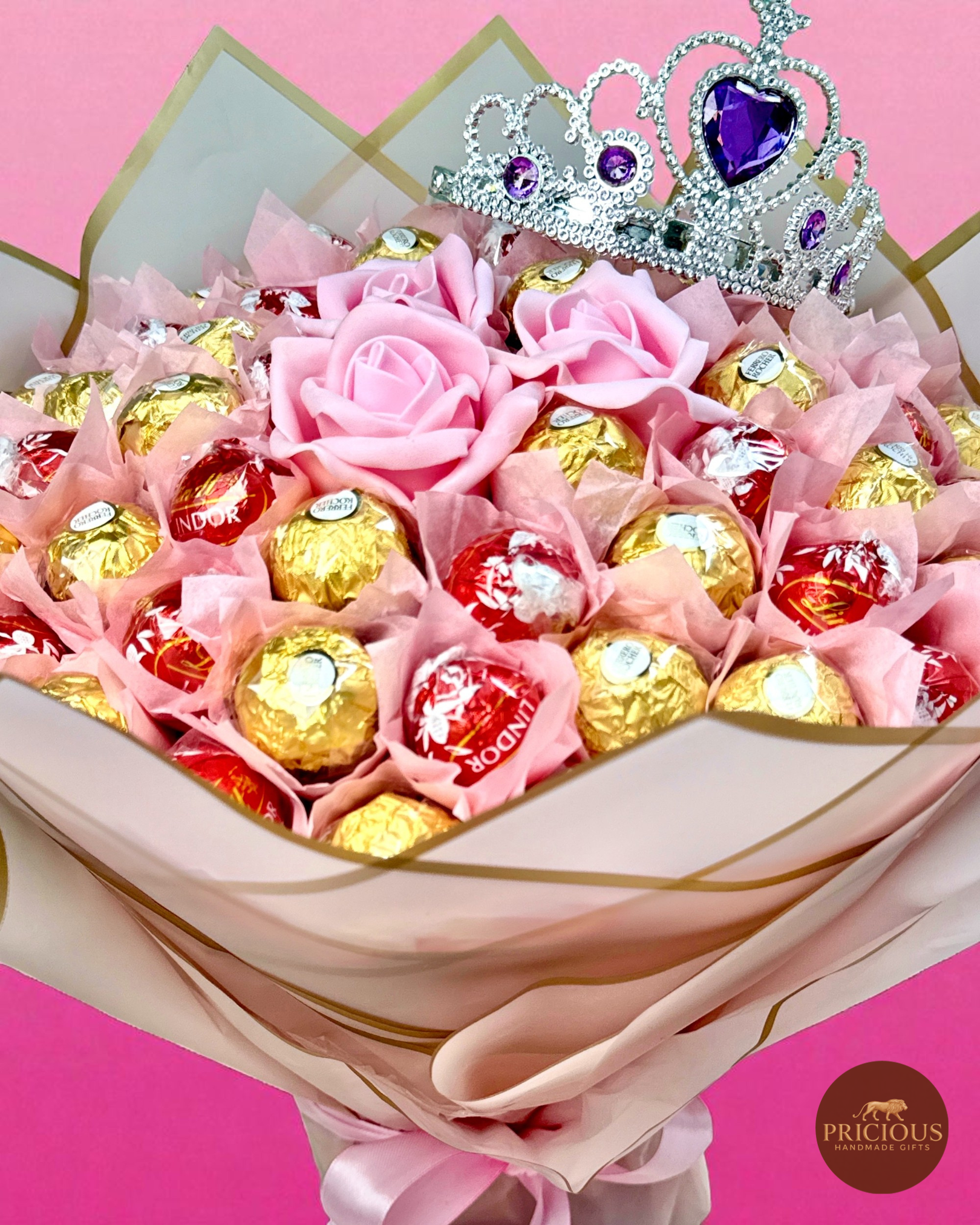Close-up of tiara crown over Ferrero Rocher & Lindor truffles