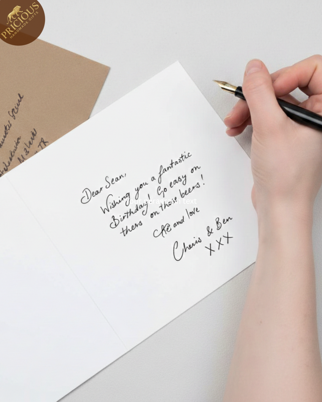 Handwritten birthday message on a card with a pen and envelope.