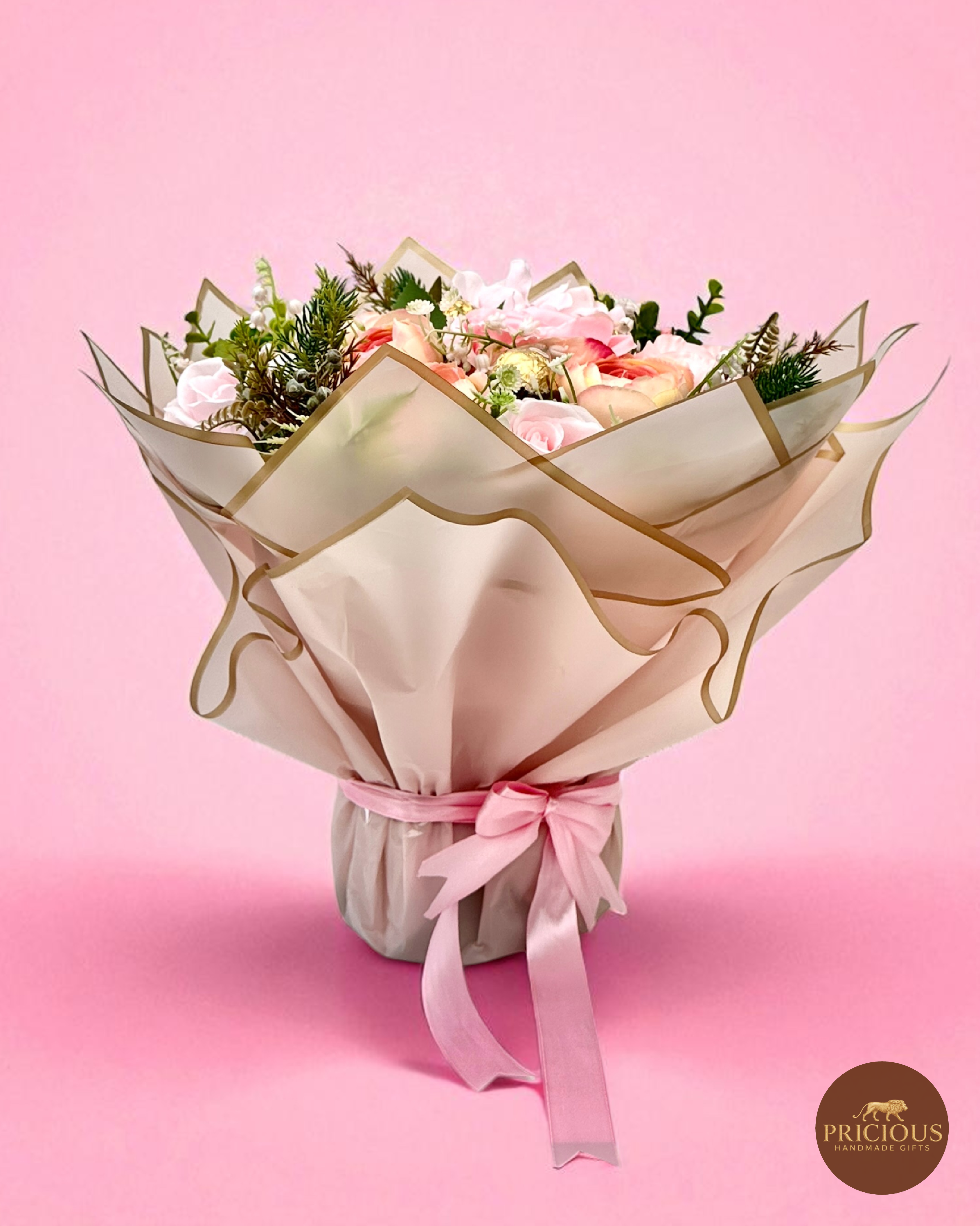 Side view luxury blush & champagne wrapped chocolate bouquet