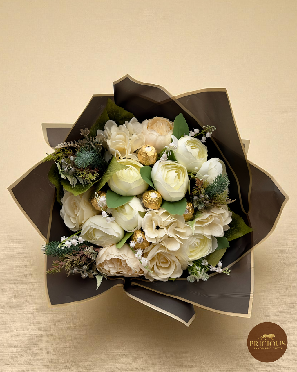 Top view ivory bouquet with Ferrero Rocher chocolates and greenery