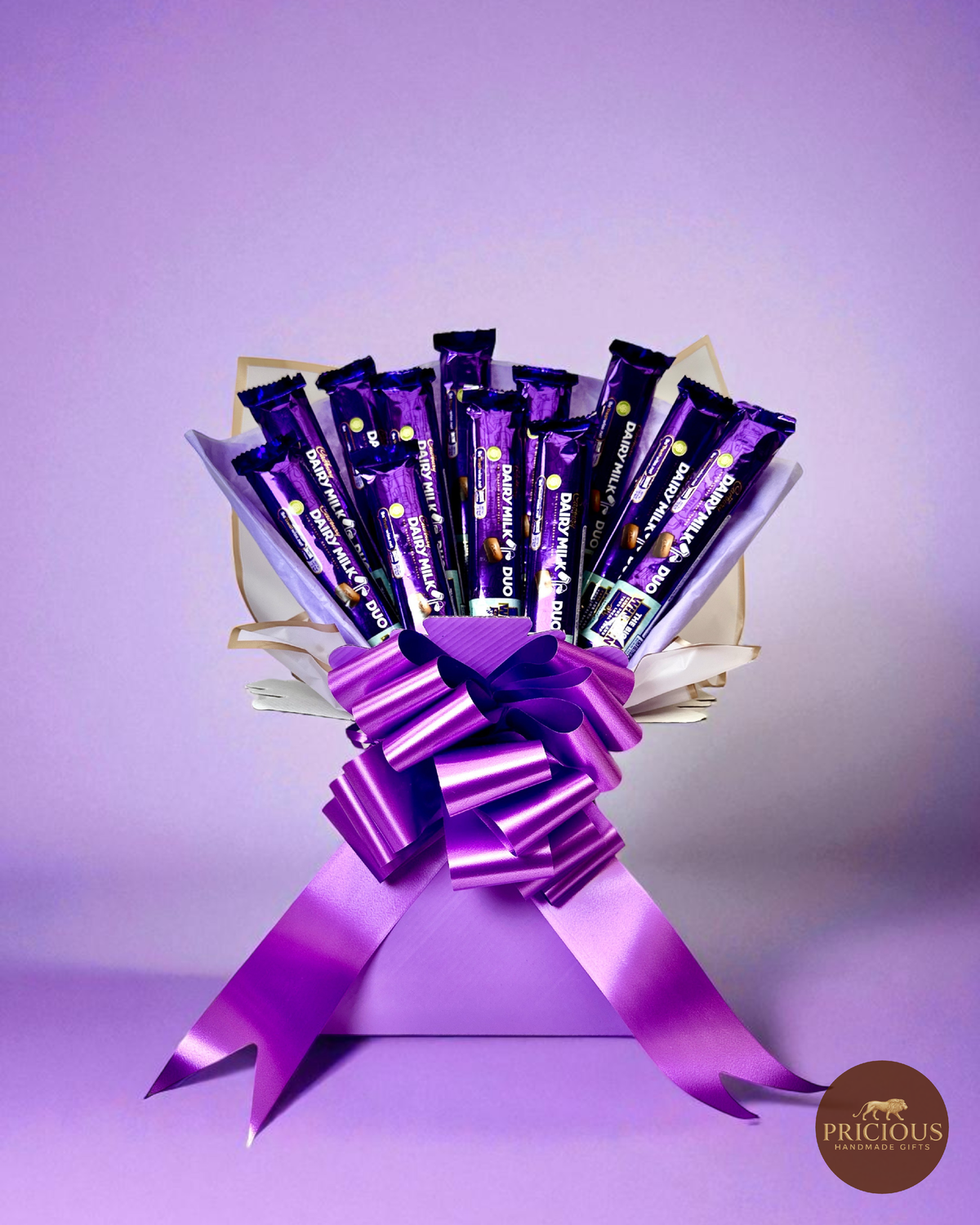 Cadbury Dairy Milk chocolate bouquet in royal purple with satin bow
