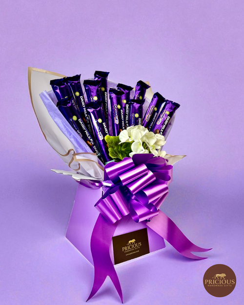 Side view of Cadbury Dairy Milk purple bouquet with ivory wrap