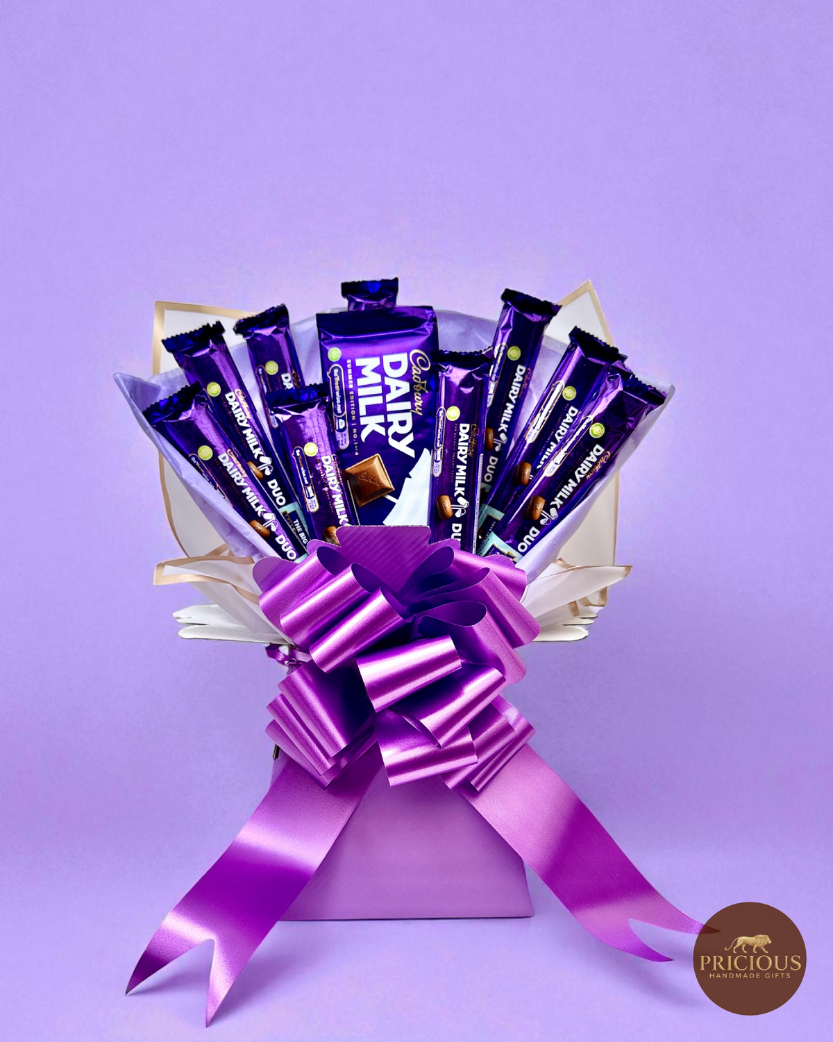 Cadbury Dairy Milk chocolate bouquet in royal purple with satin bow