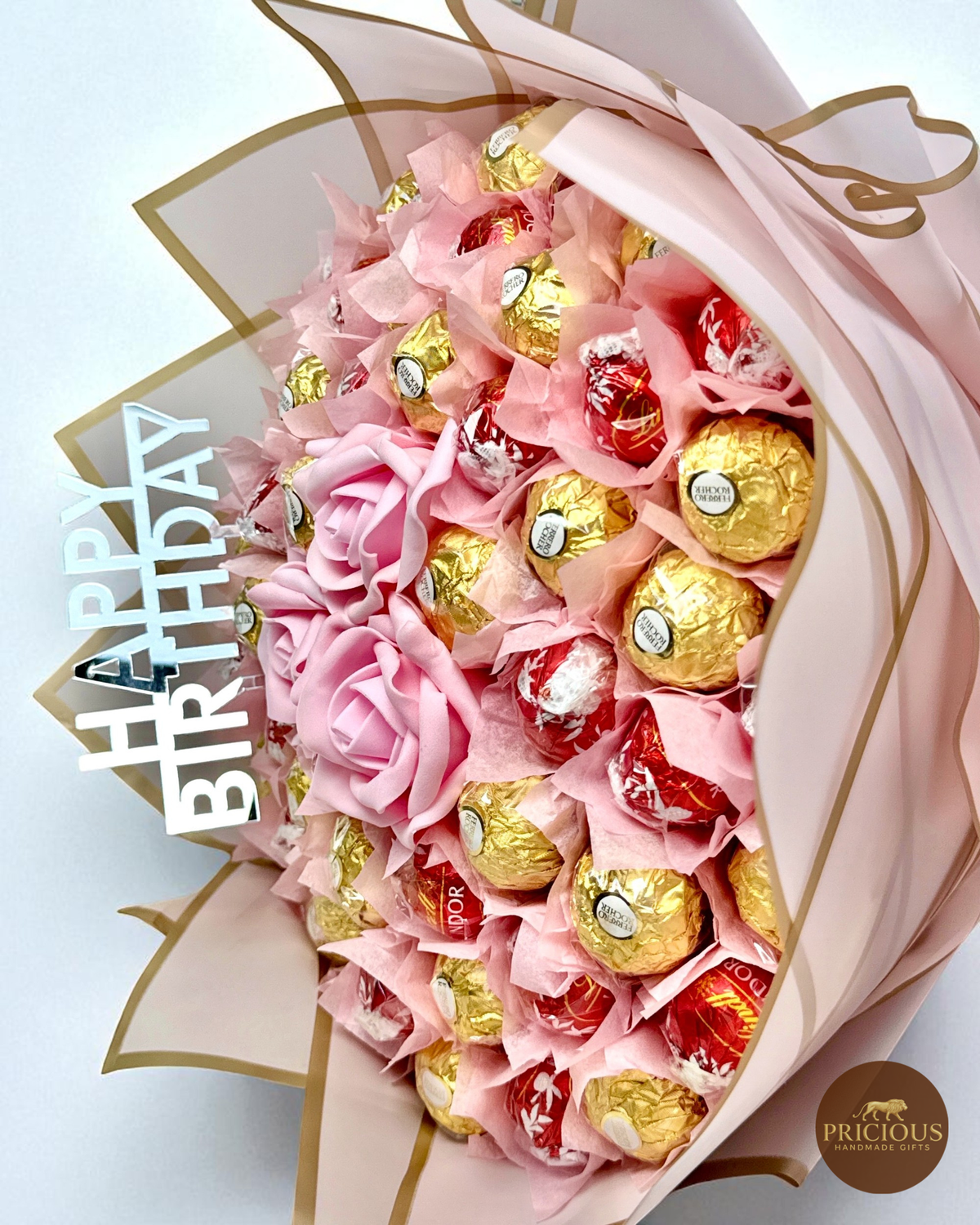 Close view pink rose chocolate bouquet with Happy Birthday topper
