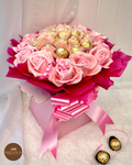 Side top view Ferrero Rocher bouquet with pink roses and satin bow