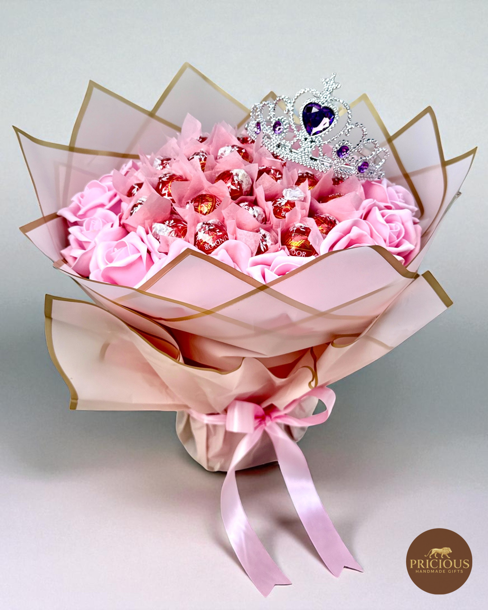 Front view pink rose bouquet with Lindt truffles and tiara