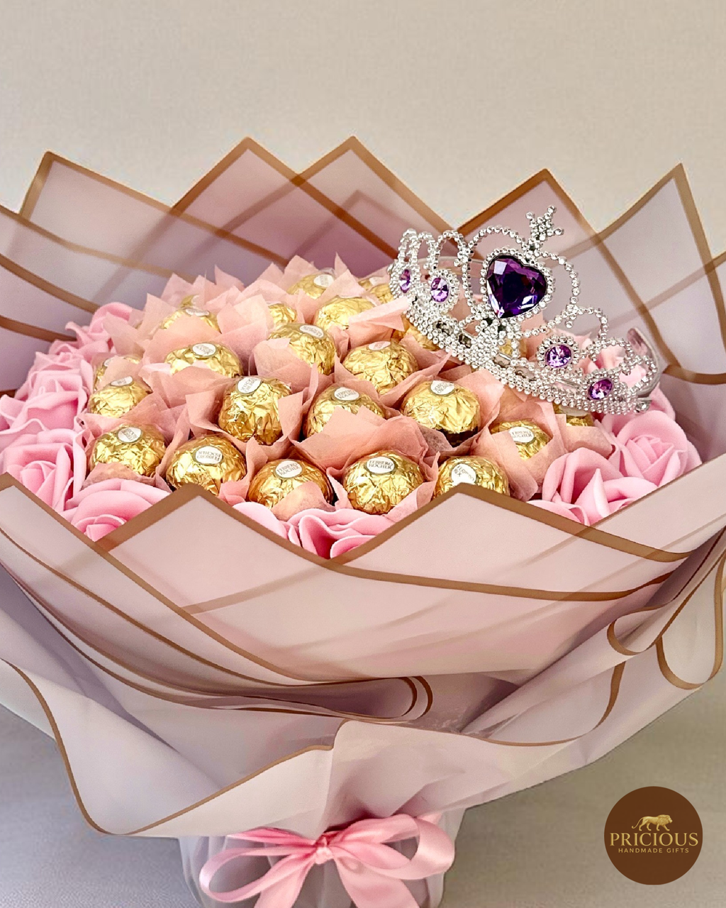 Close-up of Ferrero Rocher bouquet with purple wrap and crystal tiara
