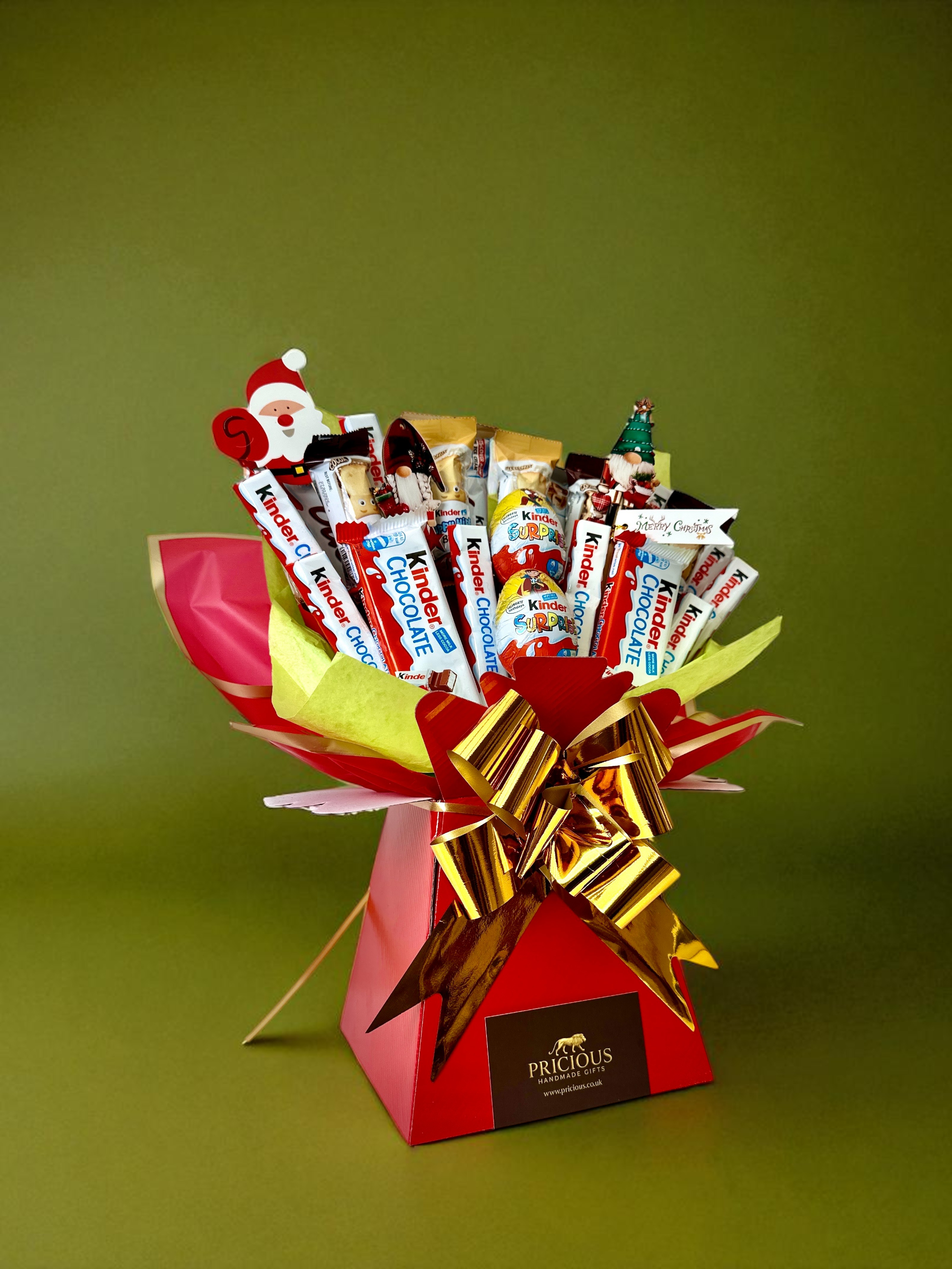 Bouquet of candy bars with a gold bow on a green background
