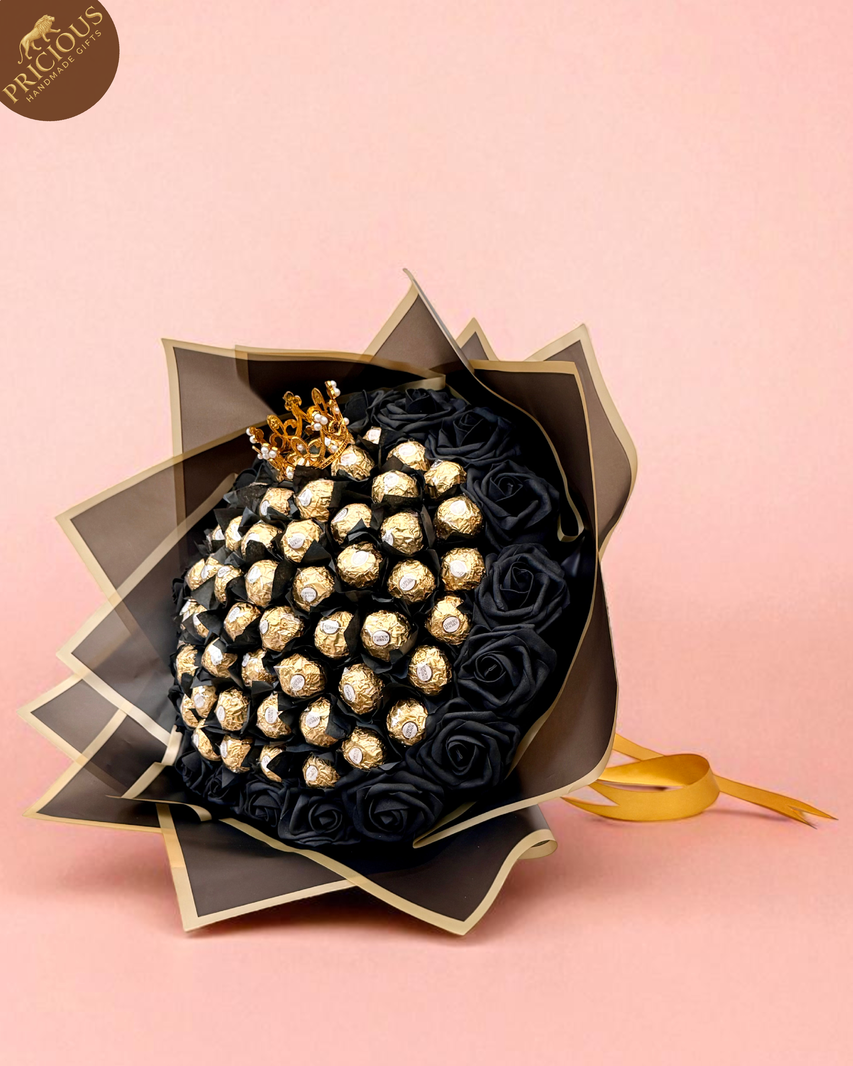 Hand-tied black & gold Ferrero Rocher chocolate bouquet with crown topper and artificial roses.