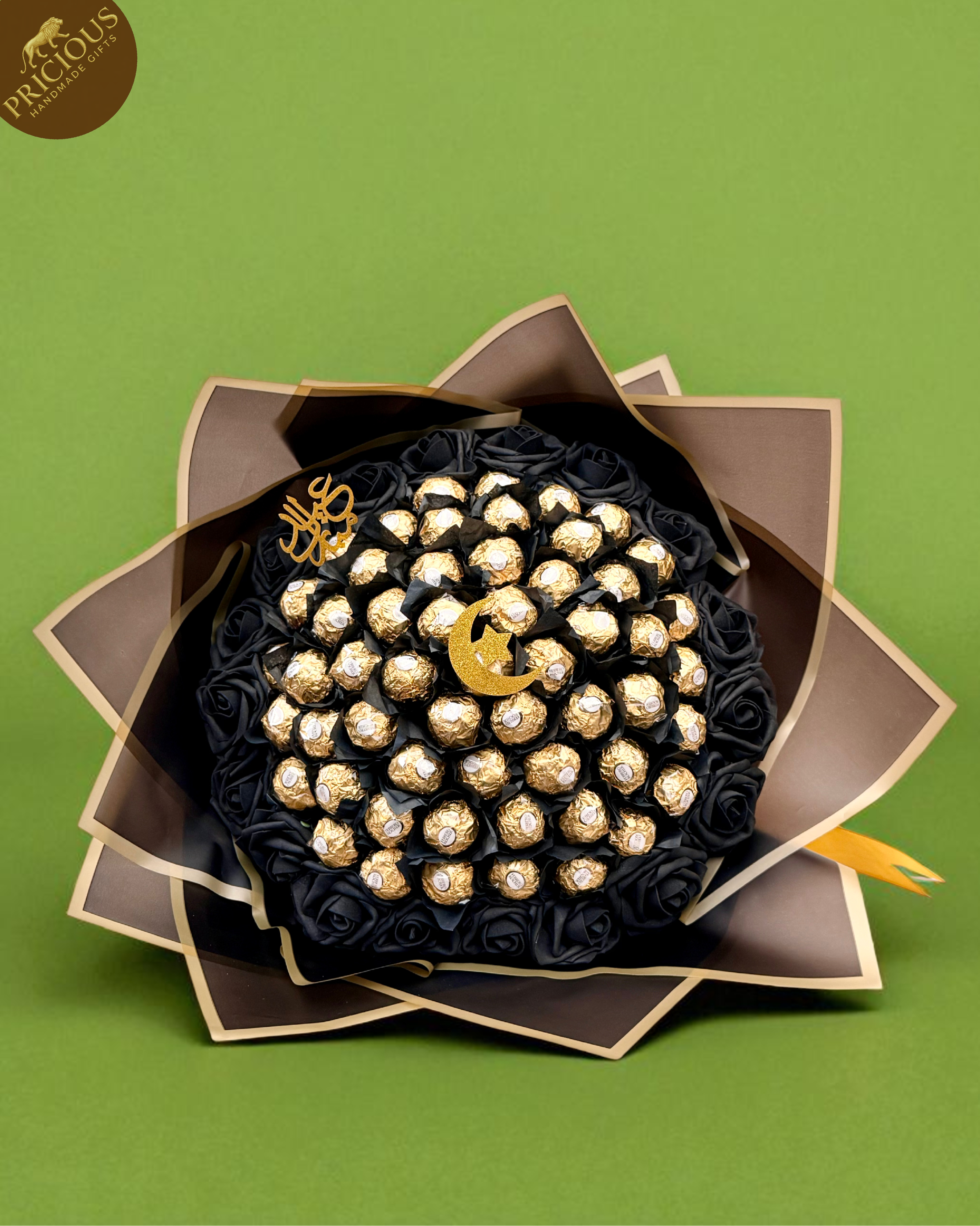 Ferrero Rocher black and gold chocolate bouquet with crescent topper and black roses.