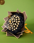 Ferrero Rocher black and gold chocolate bouquet with crescent topper and black roses.