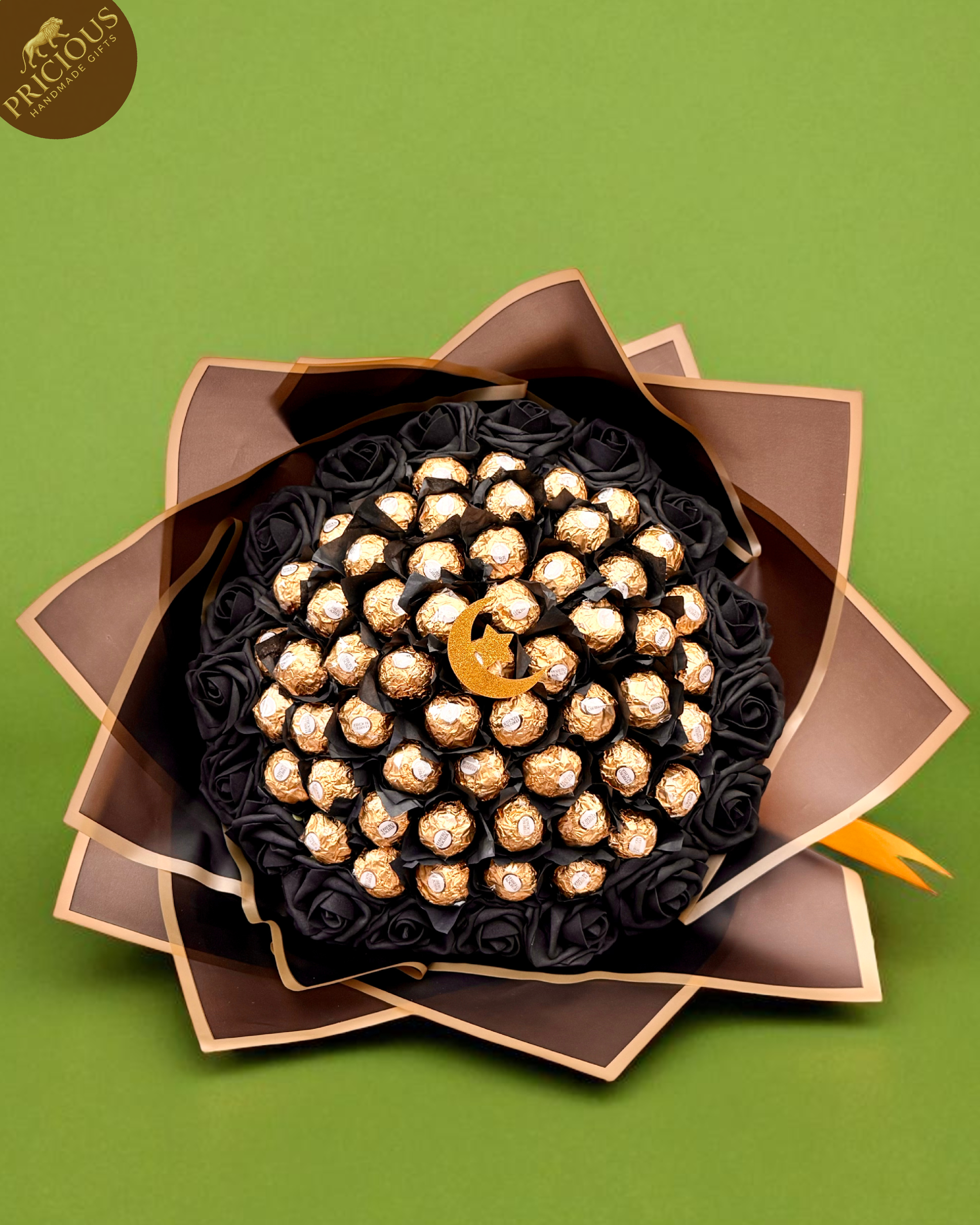 Ferrero Rocher chocolate bouquet with black roses and gold edged wrap, crescent moon topper.