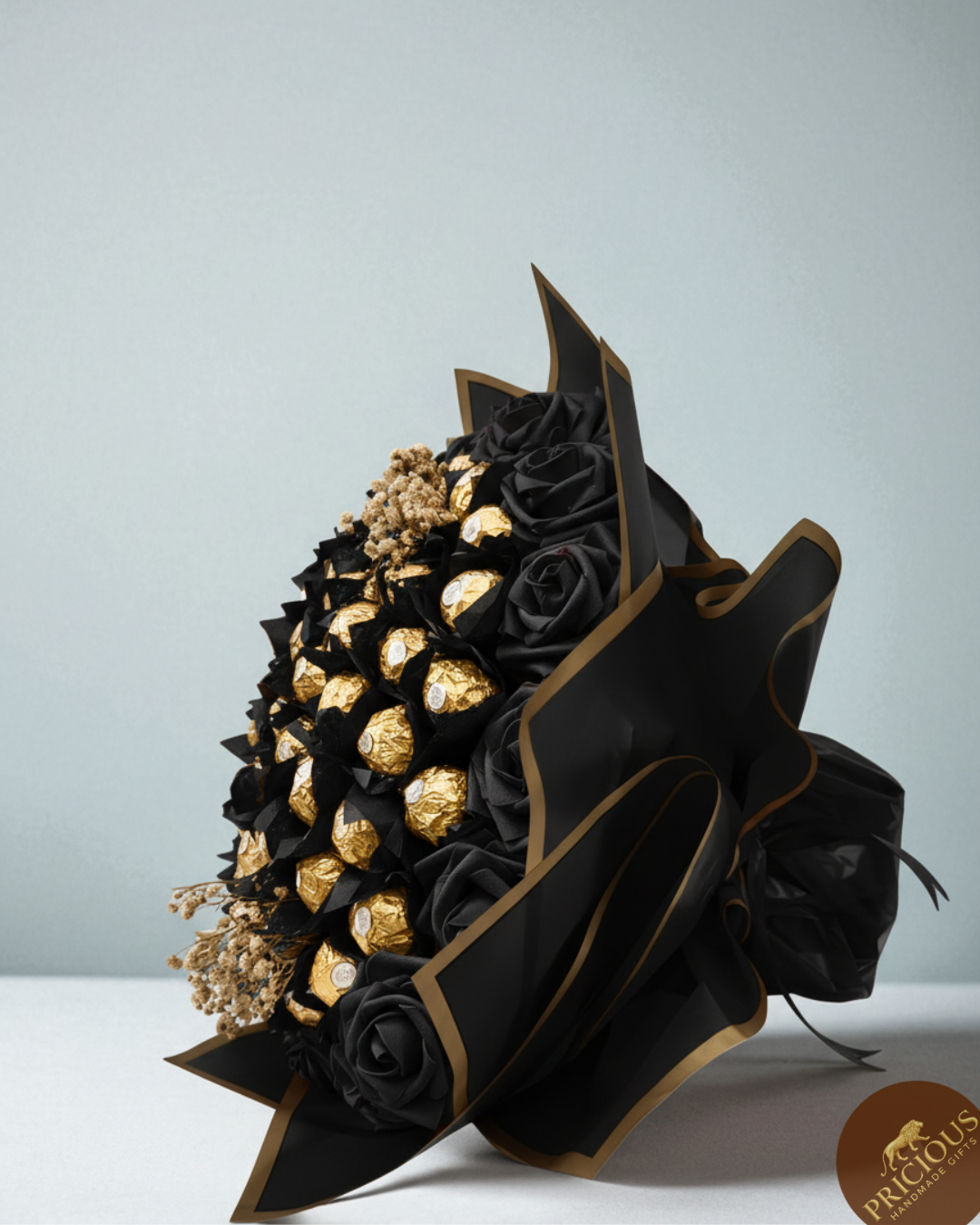 Luxury black and gold Ferrero Rocher chocolate bouquet with black roses.