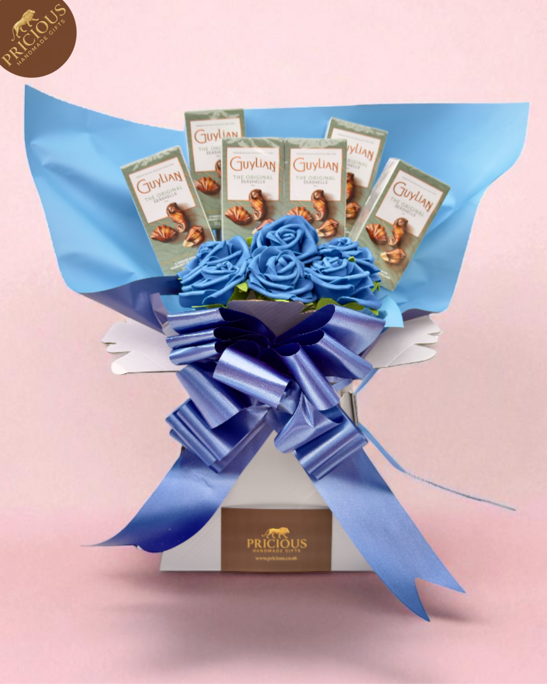 Handmade blue bouquet box with Guylian Seashells bars and artificial blue roses, hand-tied ribbon.