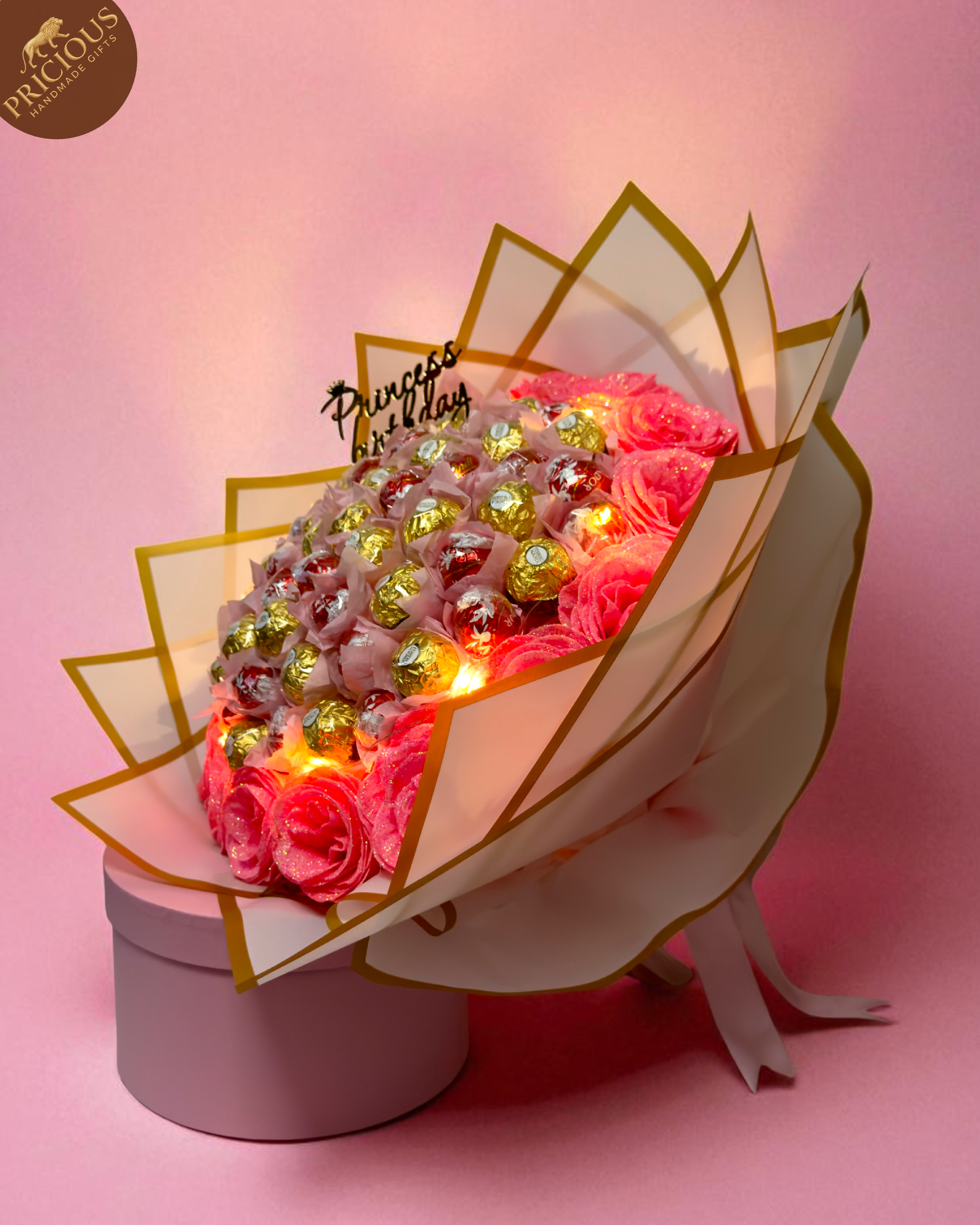 Hand-tied Princess Birthday chocolate bouquet in pink & gold with Ferrero Rocher, Lindt Lindor and glitter roses.