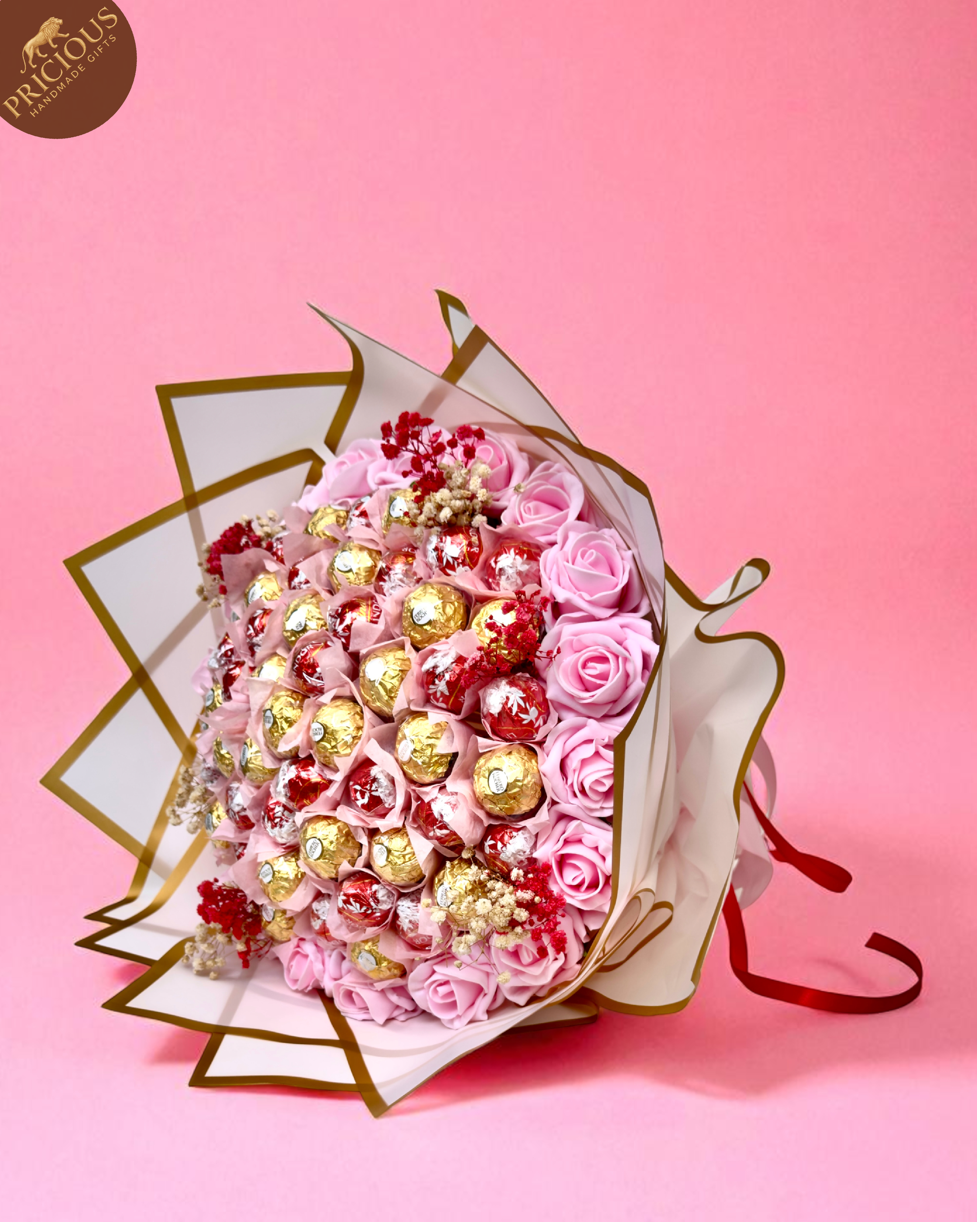 Hand-tied blush-pink chocolate bouquet with Ferrero & Lindor, artificial roses.