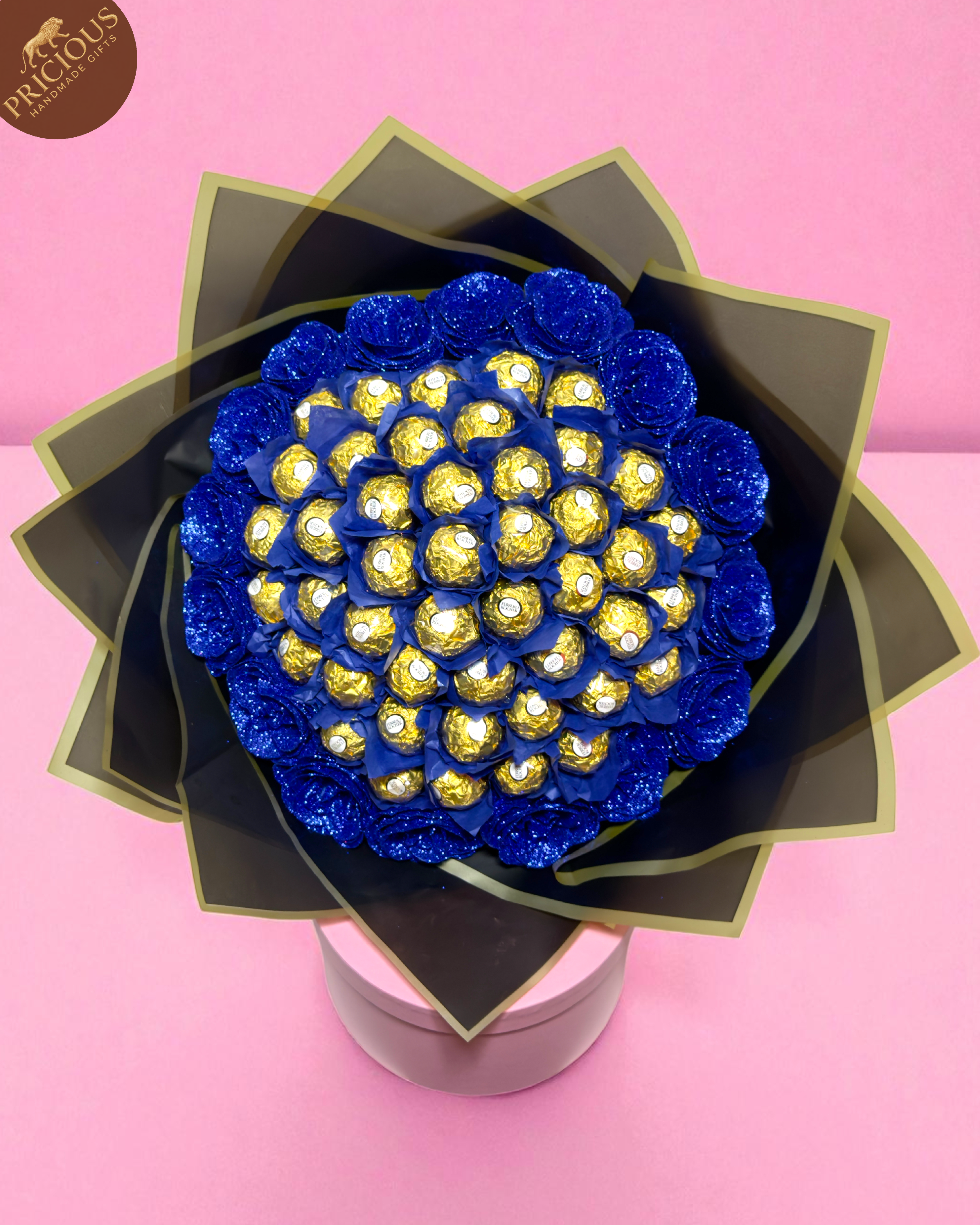 Top view of Blue & Gold Ferrero Rocher bouquet showing layered wrap, neat arrangement and artificial roses.