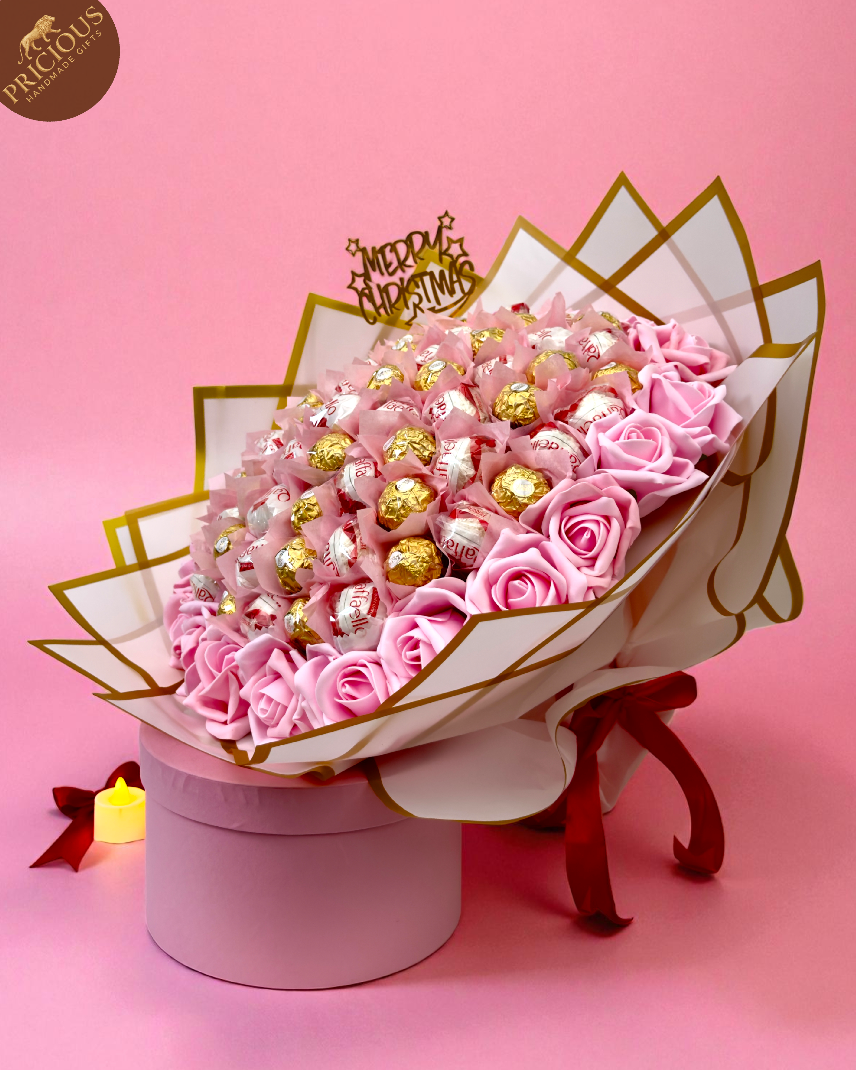 Hand-tied chocolate bouquet with Ferrero Rocher & Raffaello, pink artificial roses, Christmas topper.