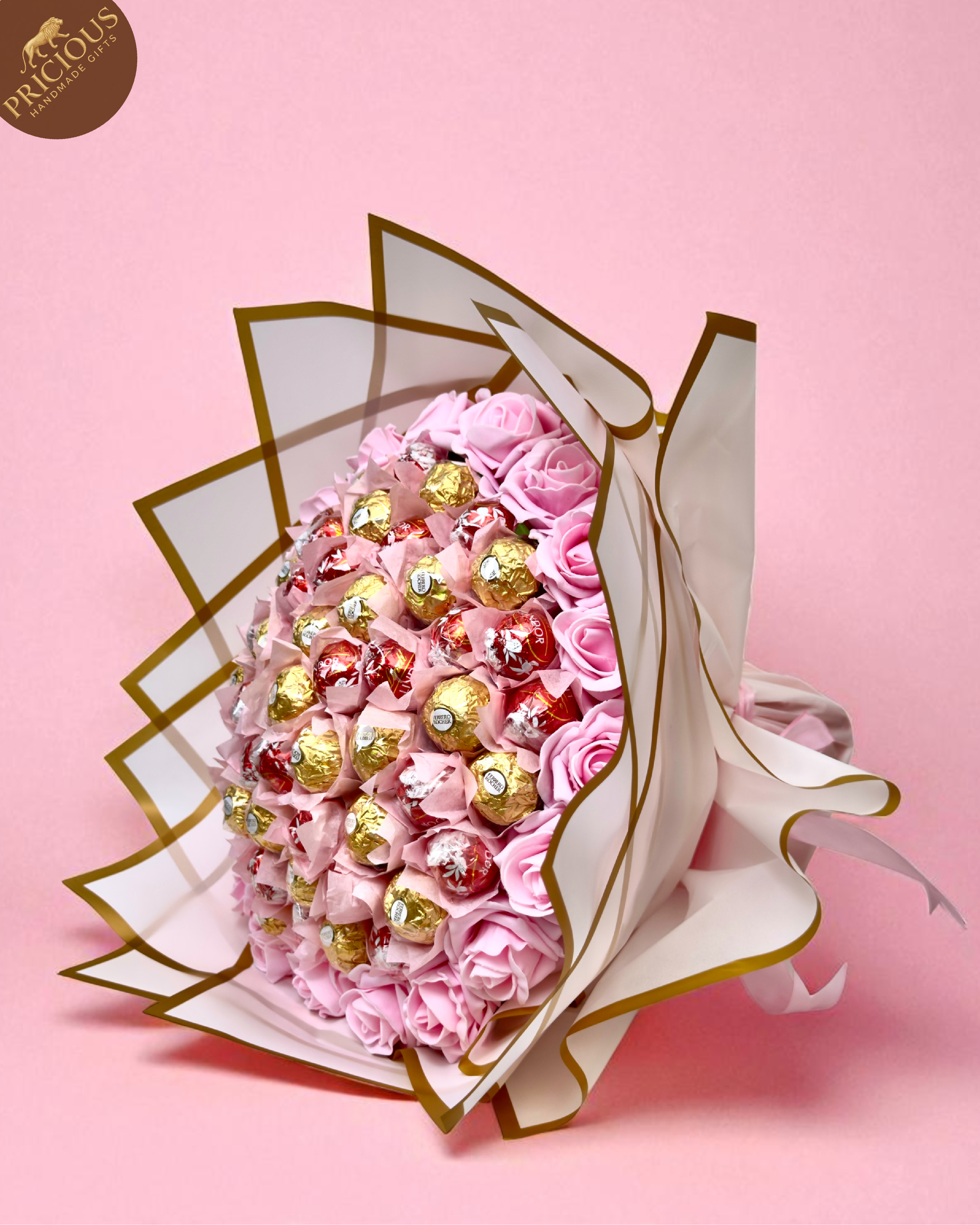 Hand-tied pink rose chocolate bouquet with Ferrero Rocher and Lindt Lindor, artificial roses.