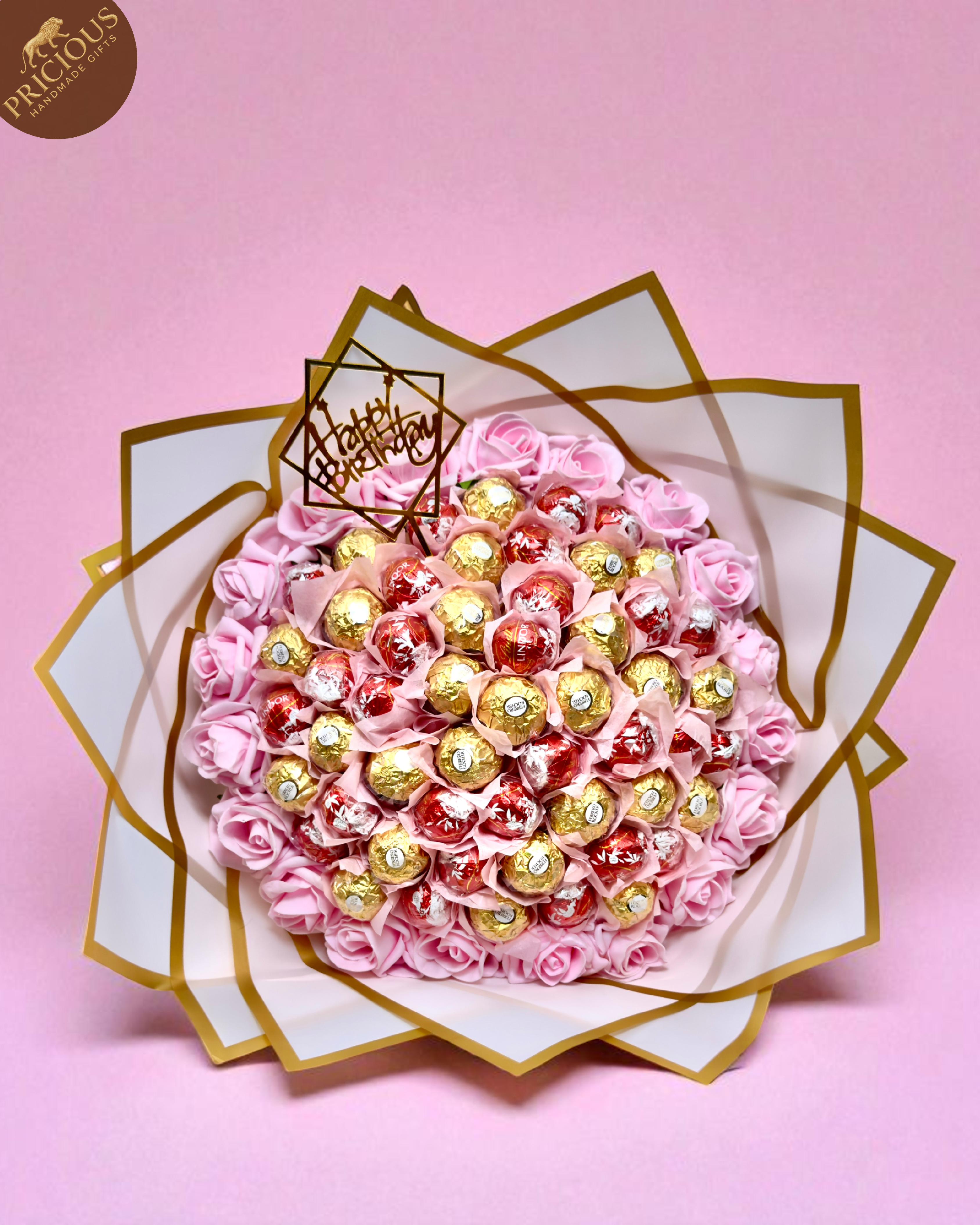 Overhead view of pink & gold chocolate bouquet with Happy Birthday topper, handmade in the UK.