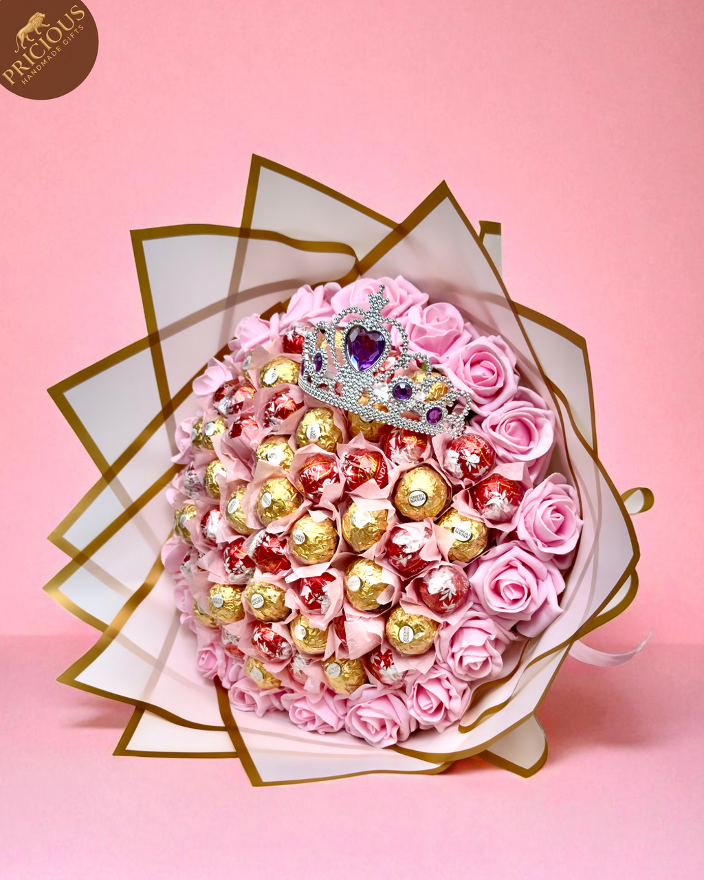 Hand-tied pink tiara chocolate bouquet with Ferrero Rocher, Lindt Lindor and artificial roses.