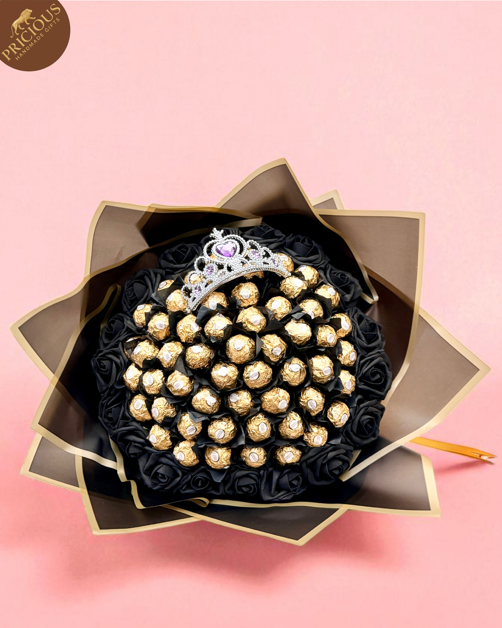 Front view of black-and-gold Ferrero Rocher bouquet with tiara and foam roses, hand-tied wrap.