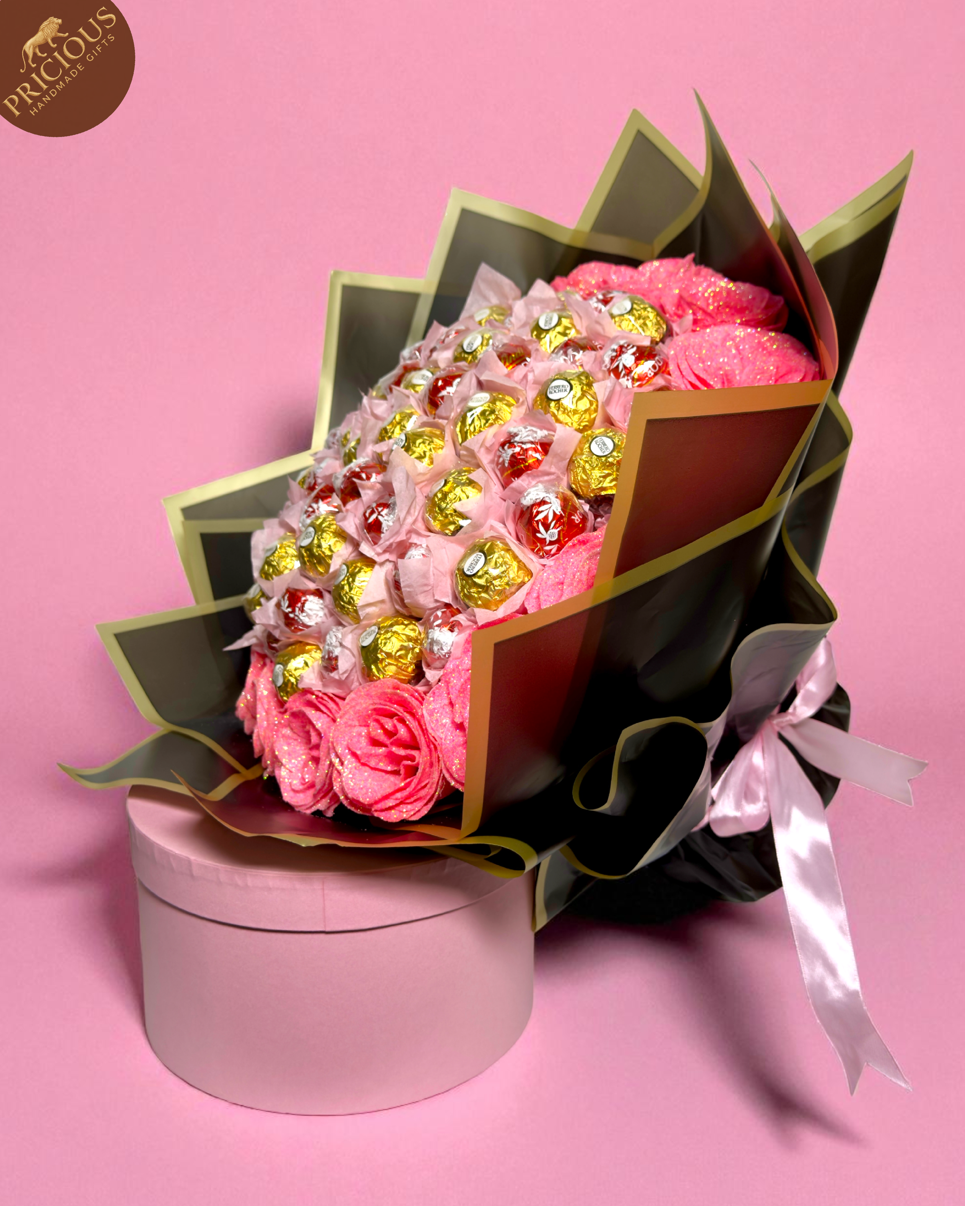 Hand-tied pink & gold chocolate bouquet with Ferrero Rocher, Lindt Lindor and glitter artificial roses, black wrap.