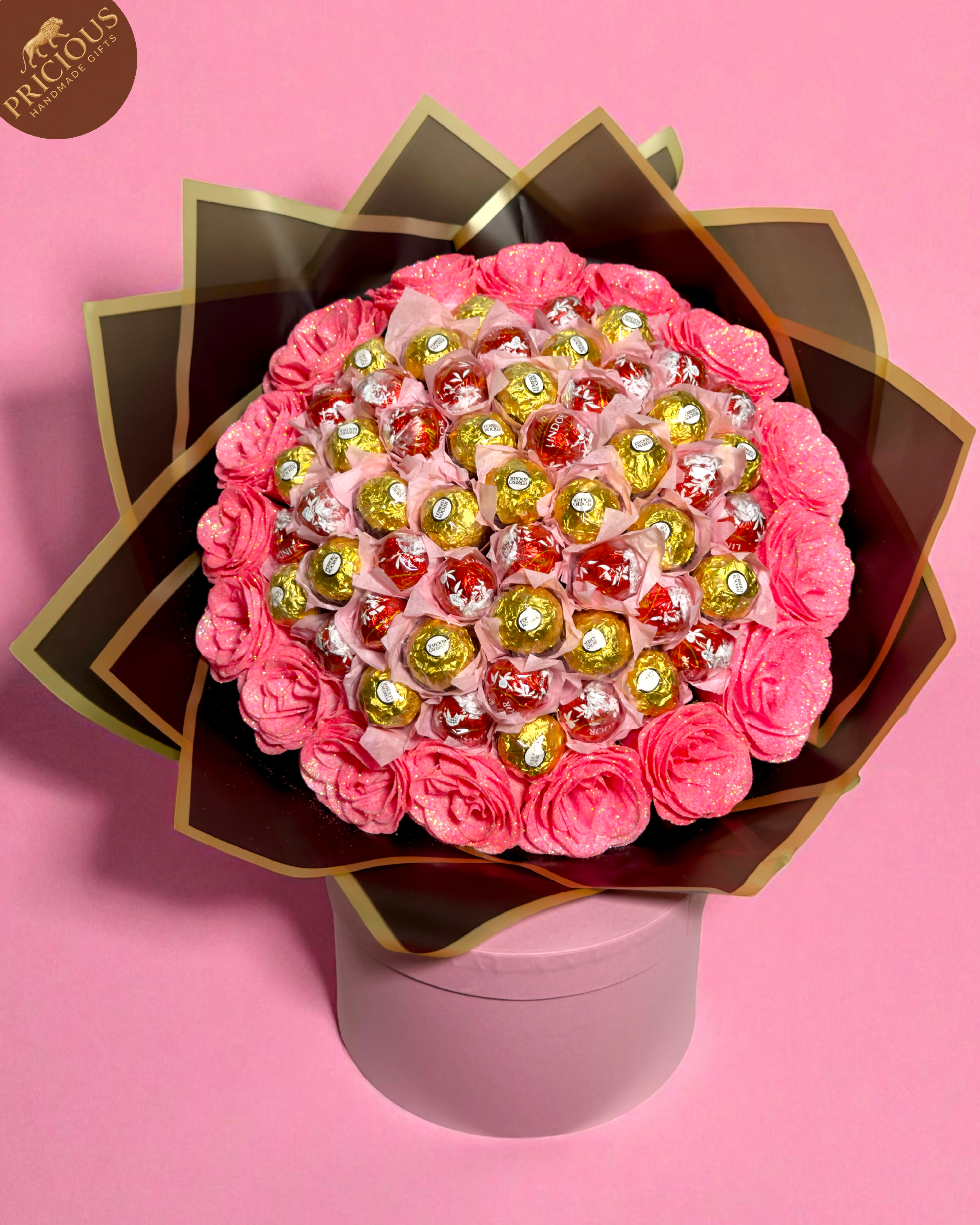 Top view of mixed-brand chocolate bouquet with glitter roses and black & gold wrap, handmade in the UK.