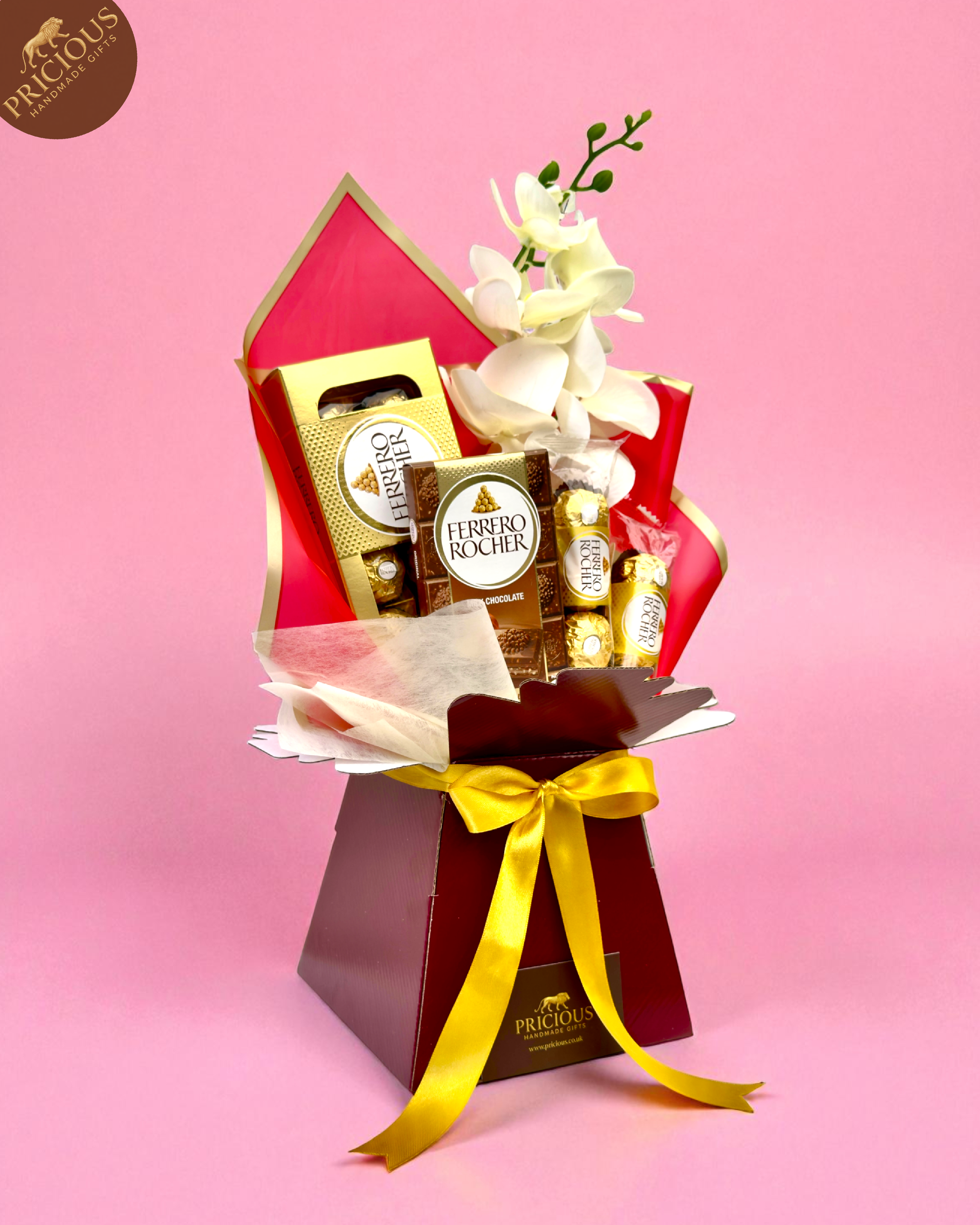 Red & gold Ferrero Rocher gift bouquet box with faux orchid and foam roses, one-size arrangement.