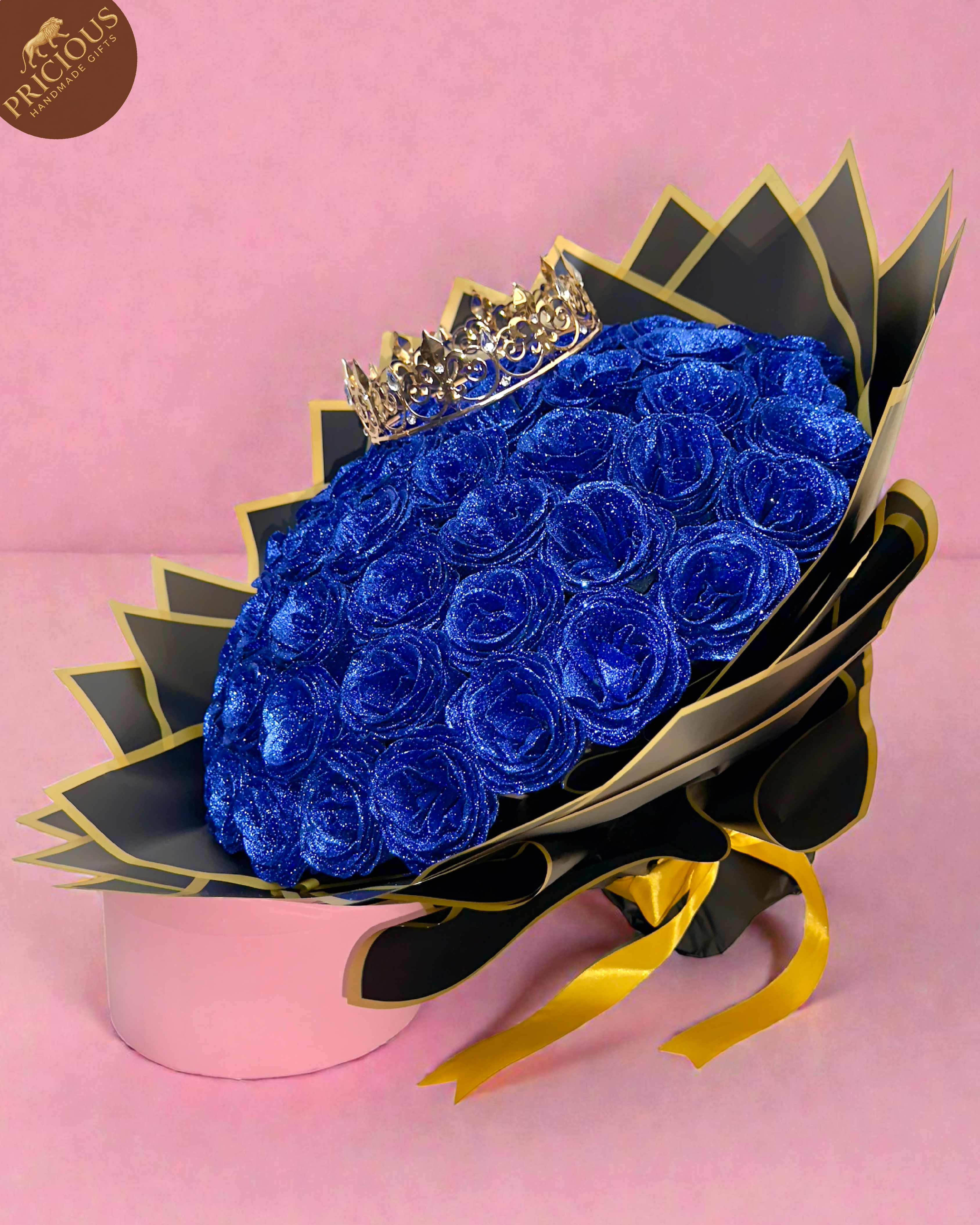 Royal blue glitter rose hand-tied bouquet with king crown in black and gold wrap