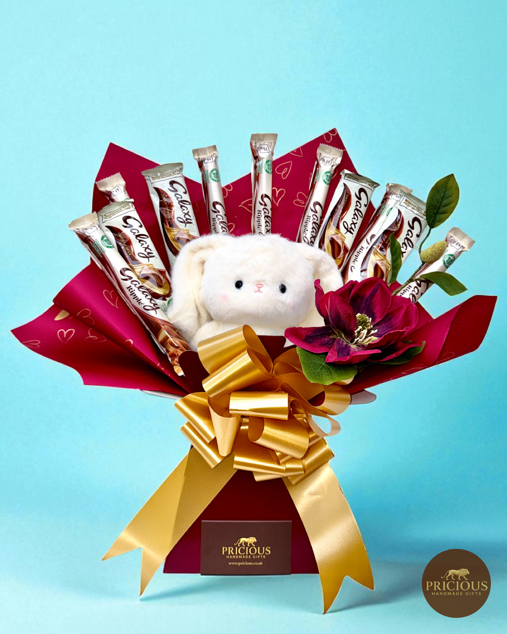 Front view of Galaxy teddy chocolate bouquet with gold bow