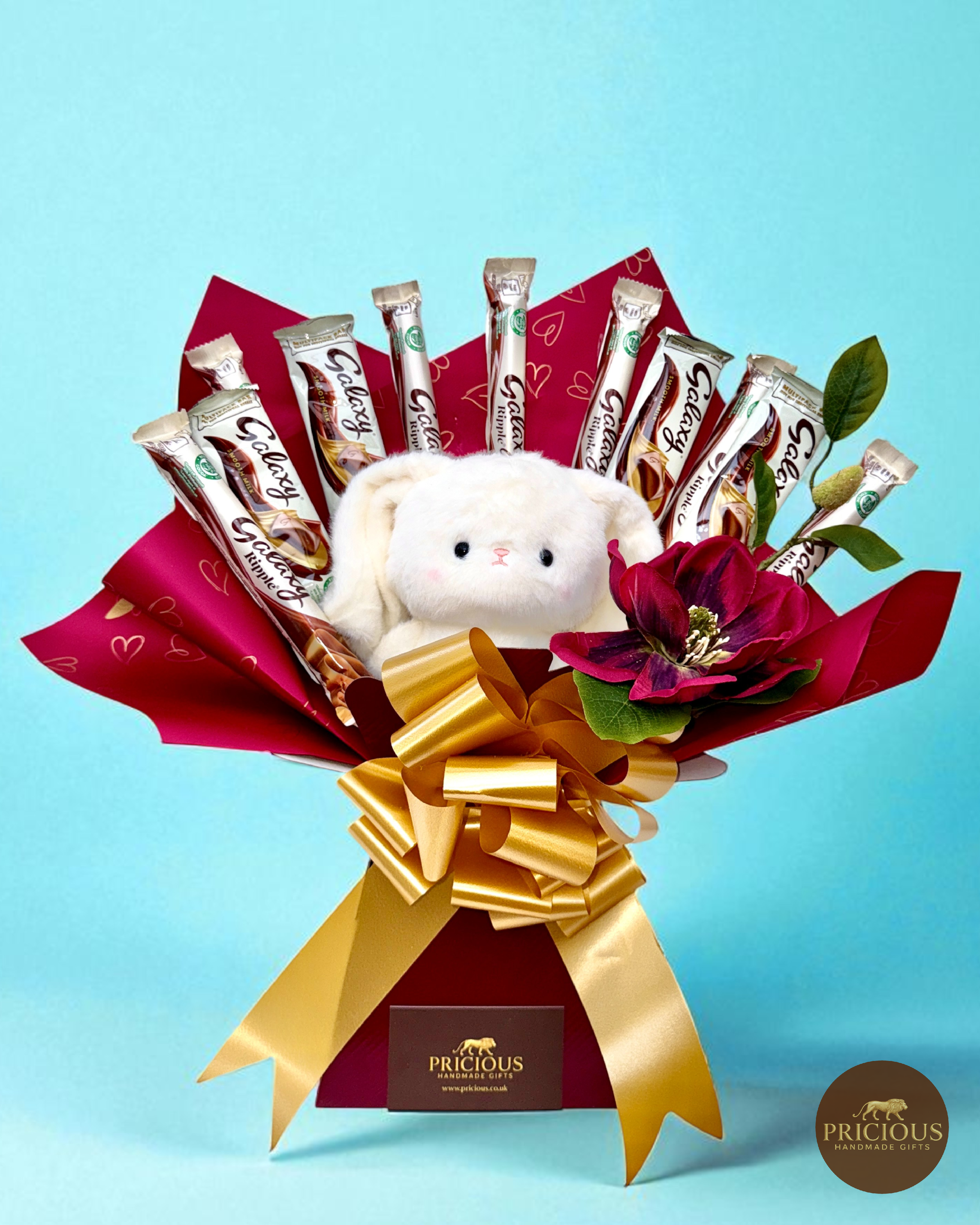 Front view of Galaxy teddy chocolate bouquet with gold bow