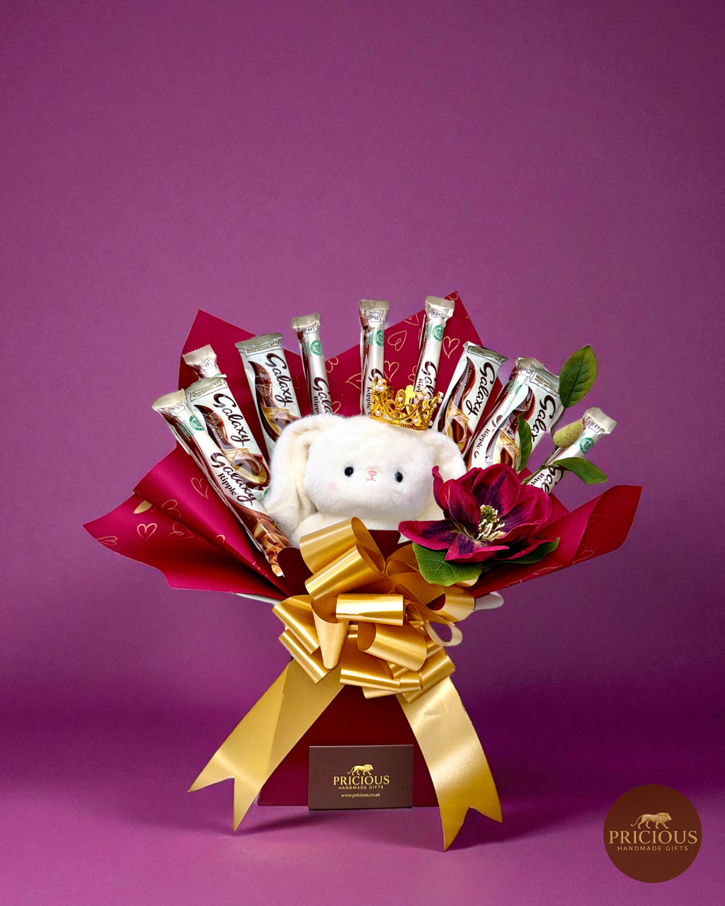 Front view of Galaxy teddy bouquet with silk flower and gold bow