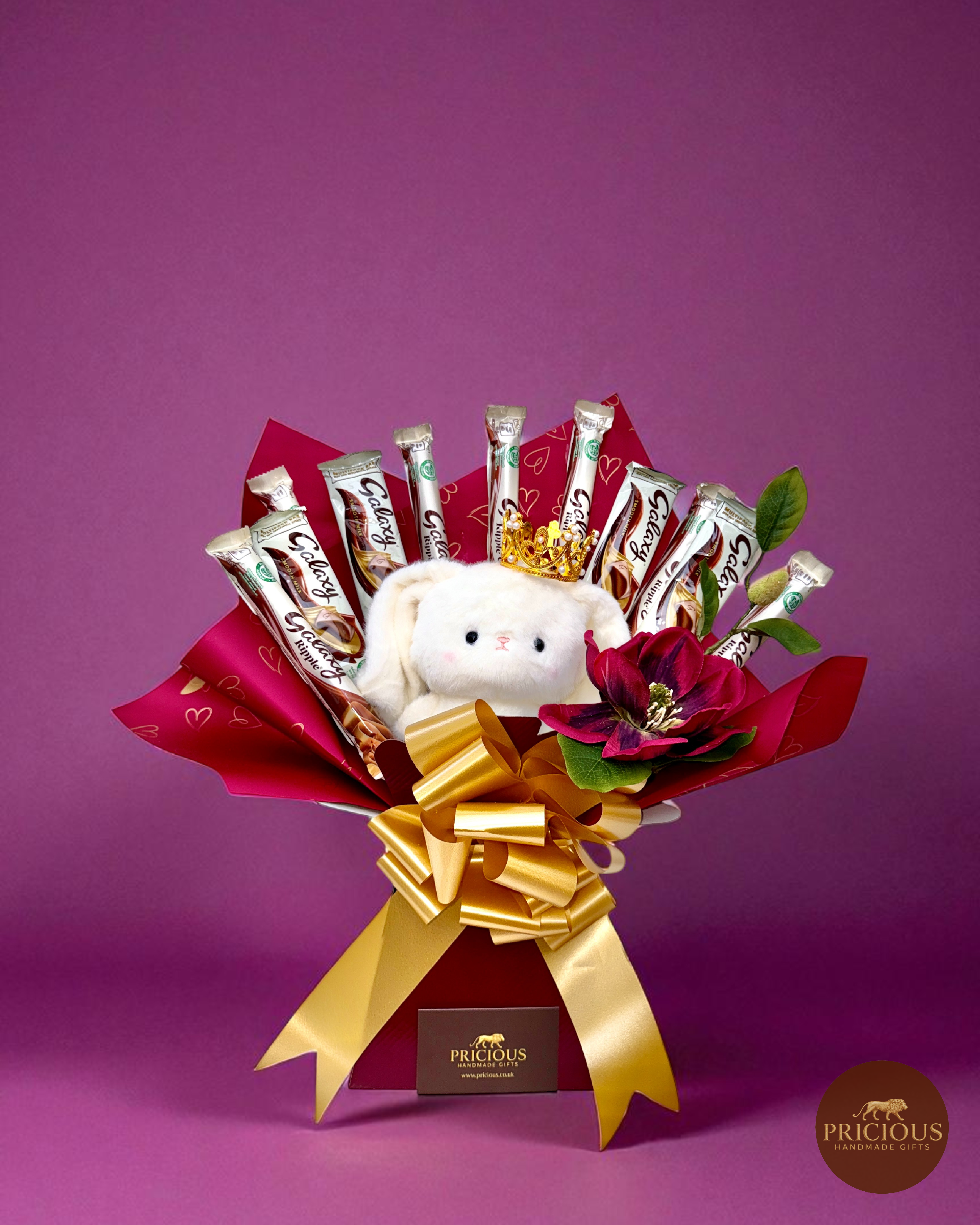 Front view of Galaxy teddy bouquet with silk flower and gold bow
