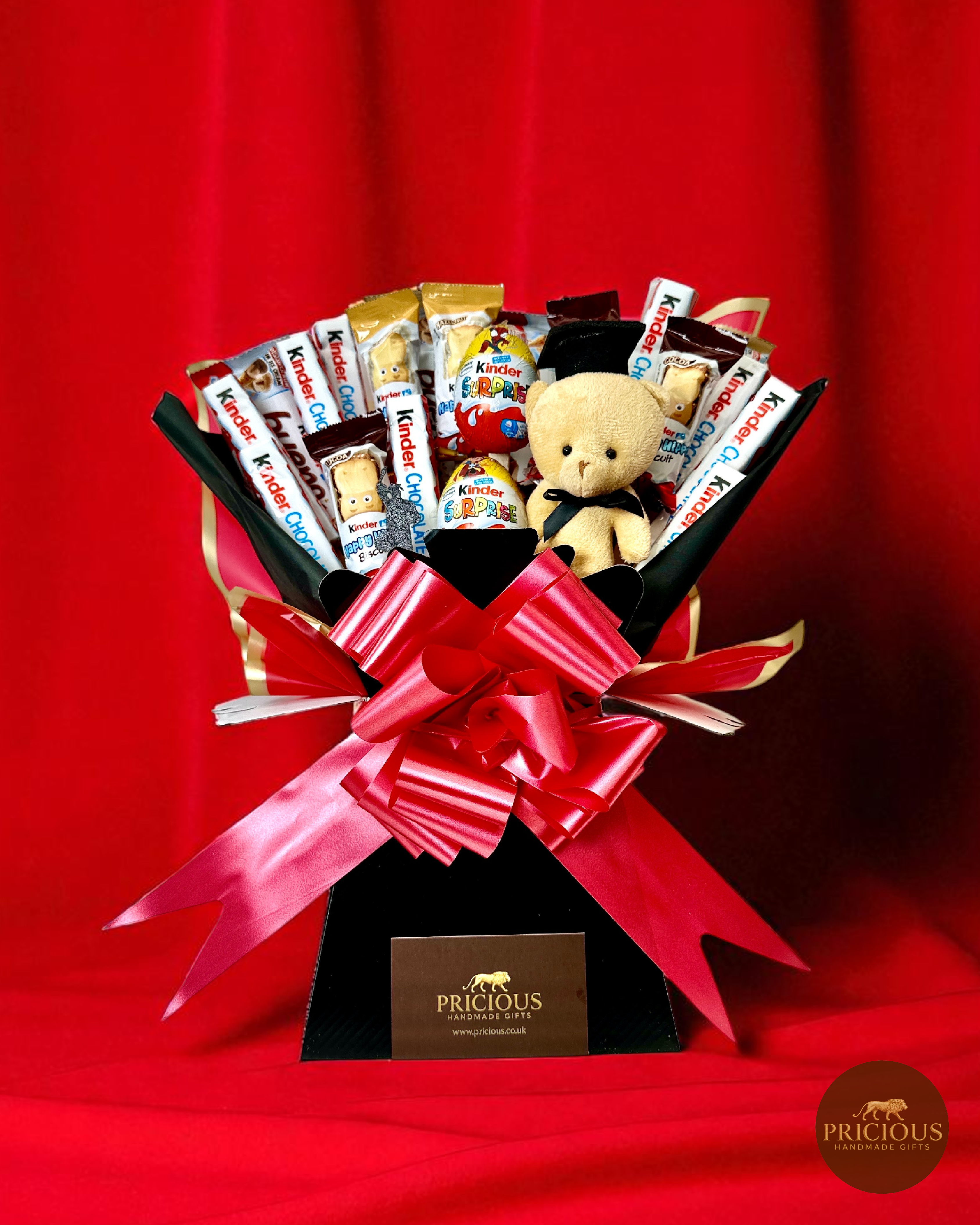 Front view Kinder graduation bouquet with bars, biscuits and teddy