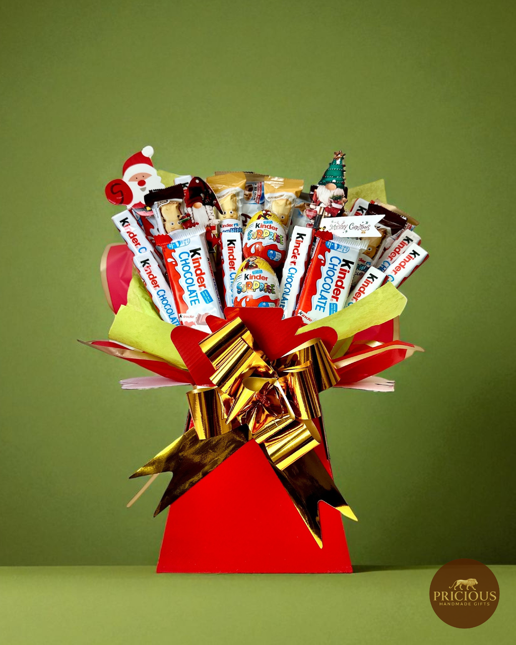 Kinder Christmas chocolate bouquet in red box with gold bow and festive toppers