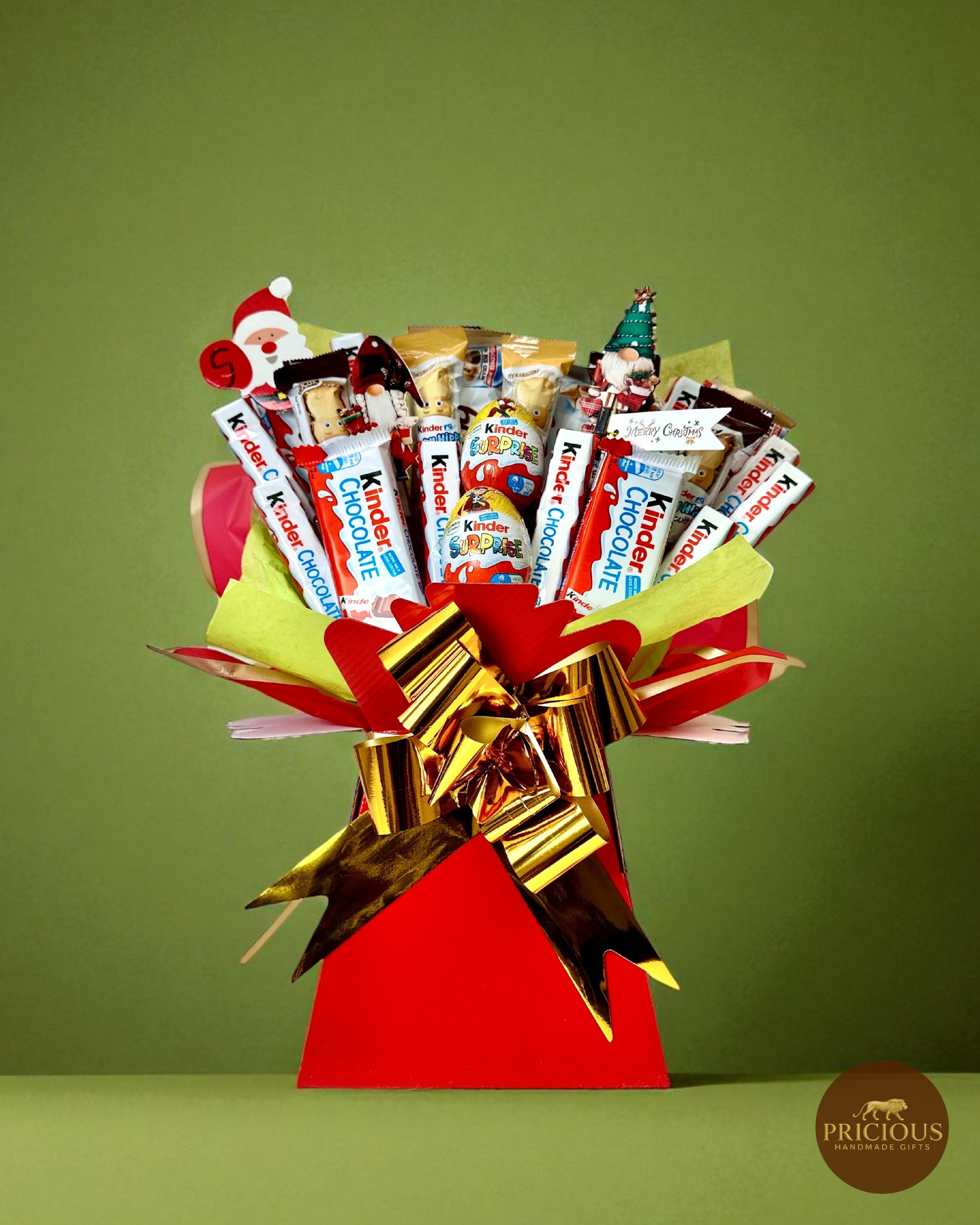 Kinder Christmas chocolate bouquet in red box with gold bow and festive toppers