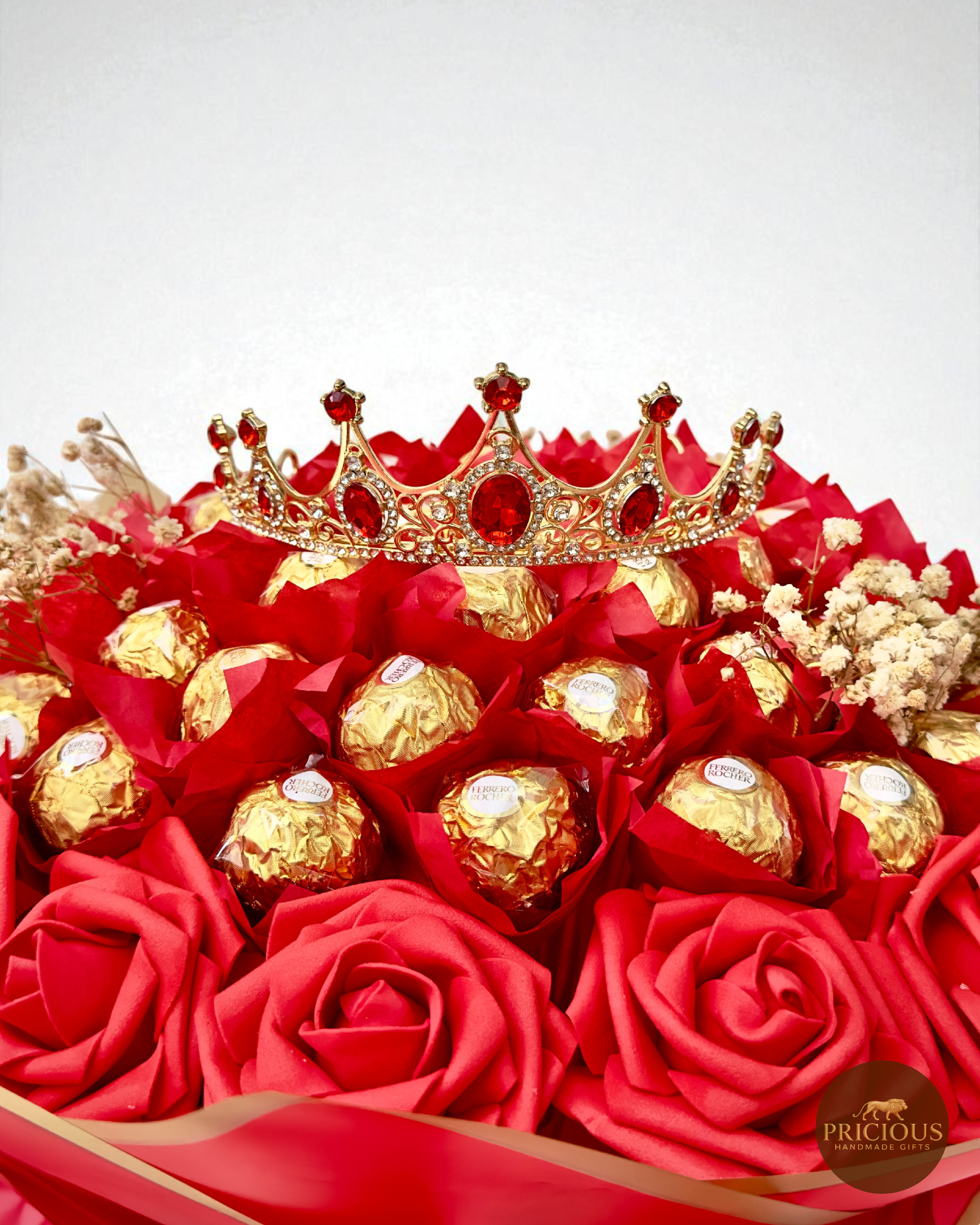 Close-up crown on Ferrero Rocher bouquet with red roses