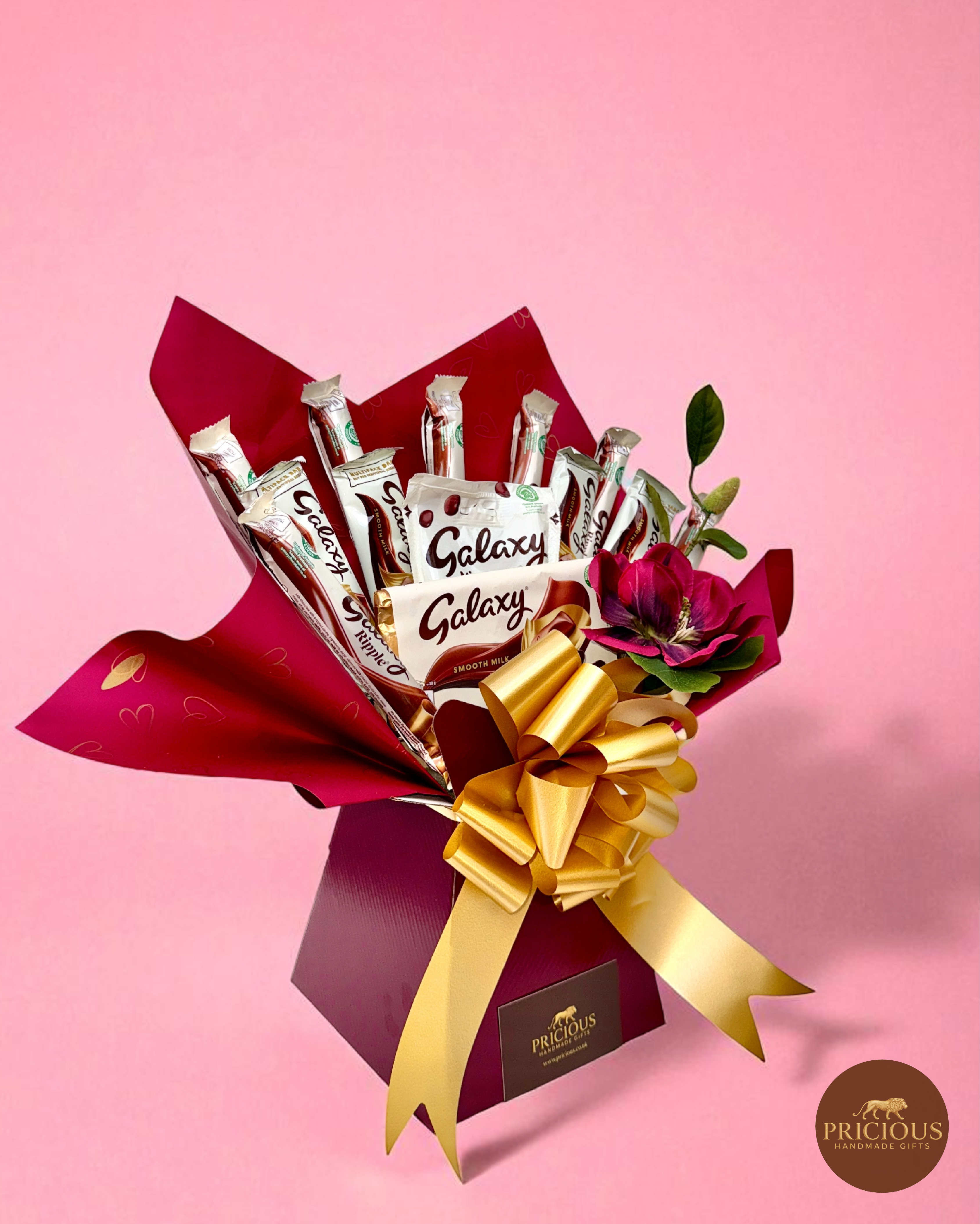 Front view Galaxy burgundy & gold chocolate bouquet with floral accent