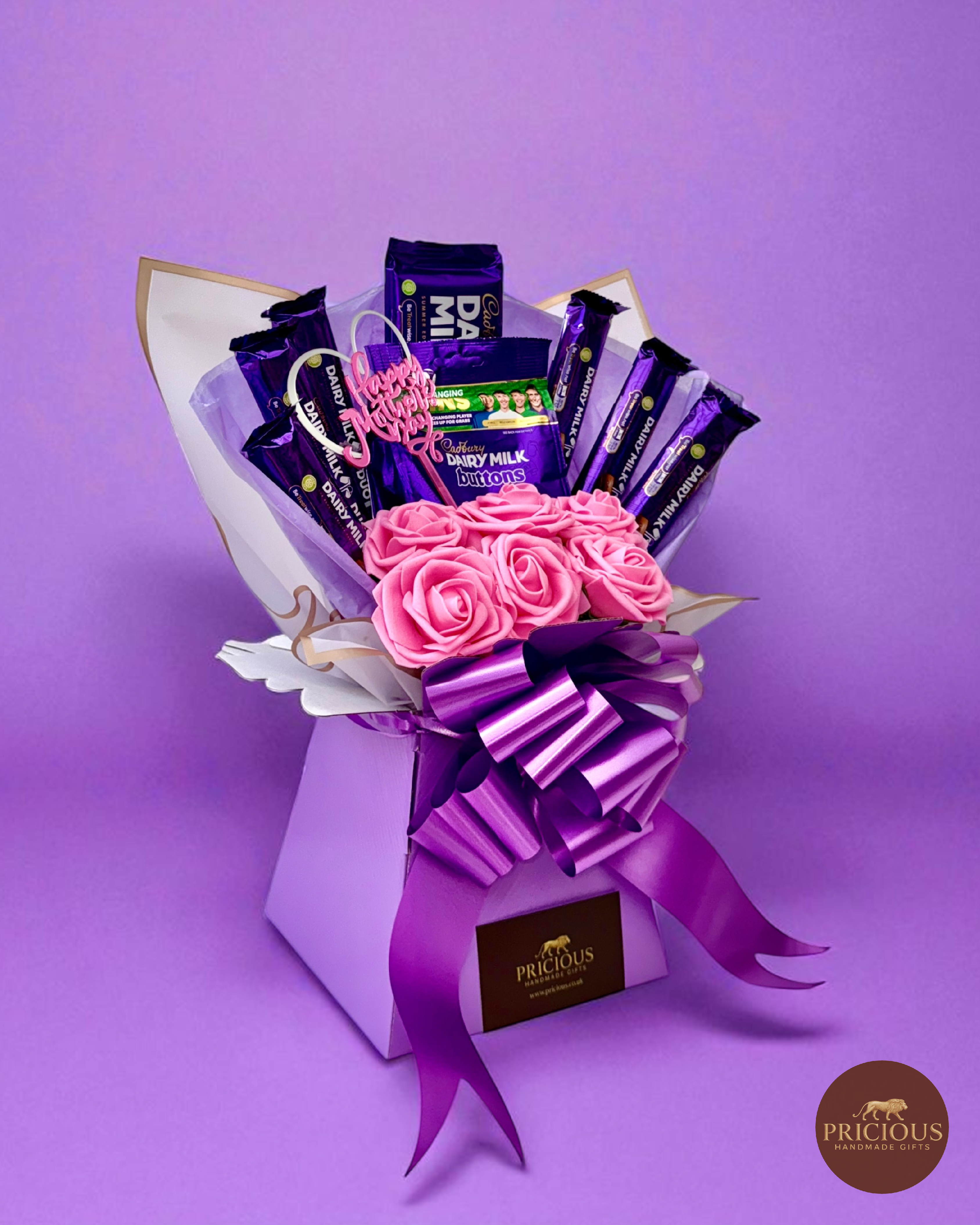 Side view Cadbury Dairy Milk bouquet with pink roses and topper