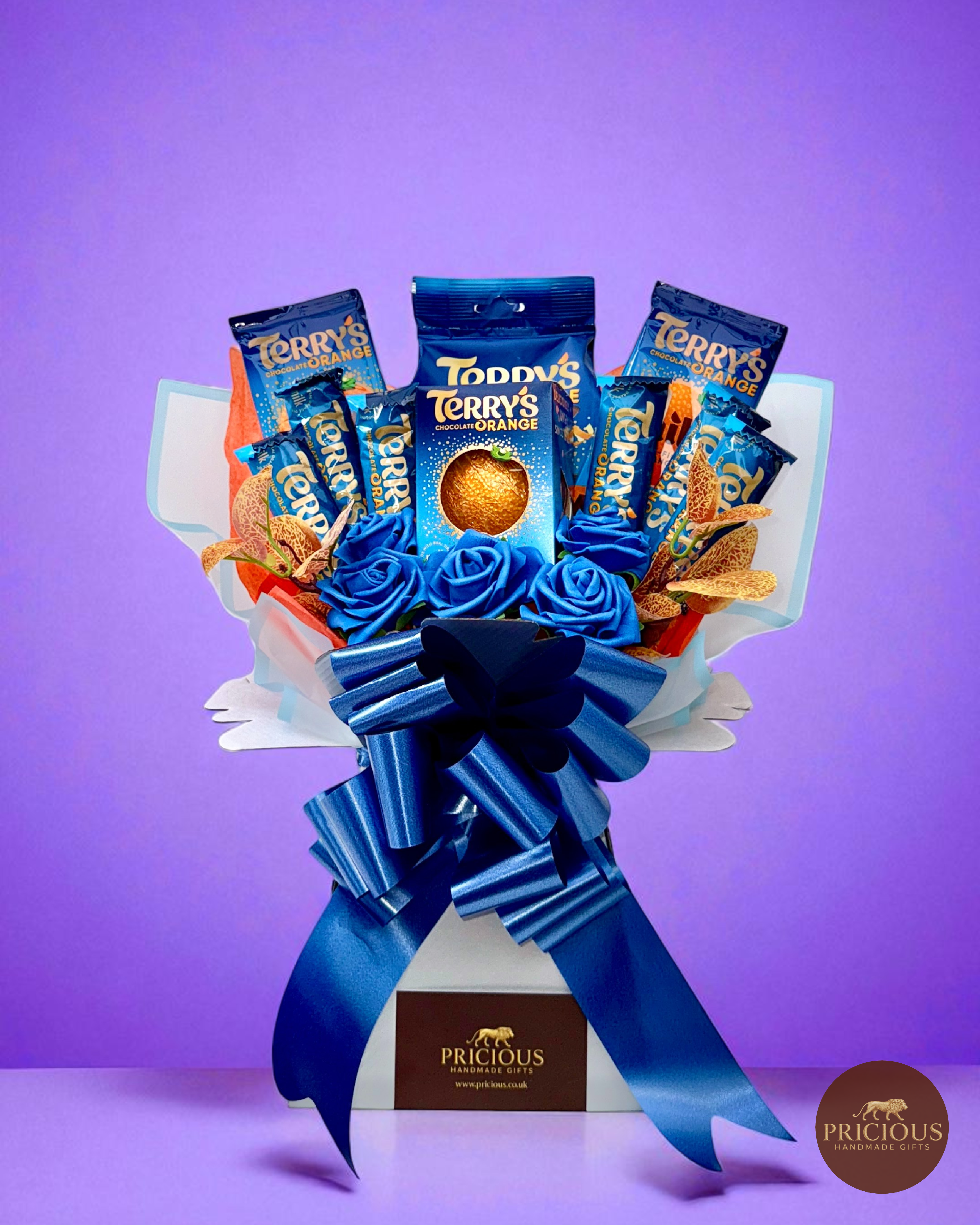 Front view Terry’s Chocolate Orange bouquet with royal-blue roses